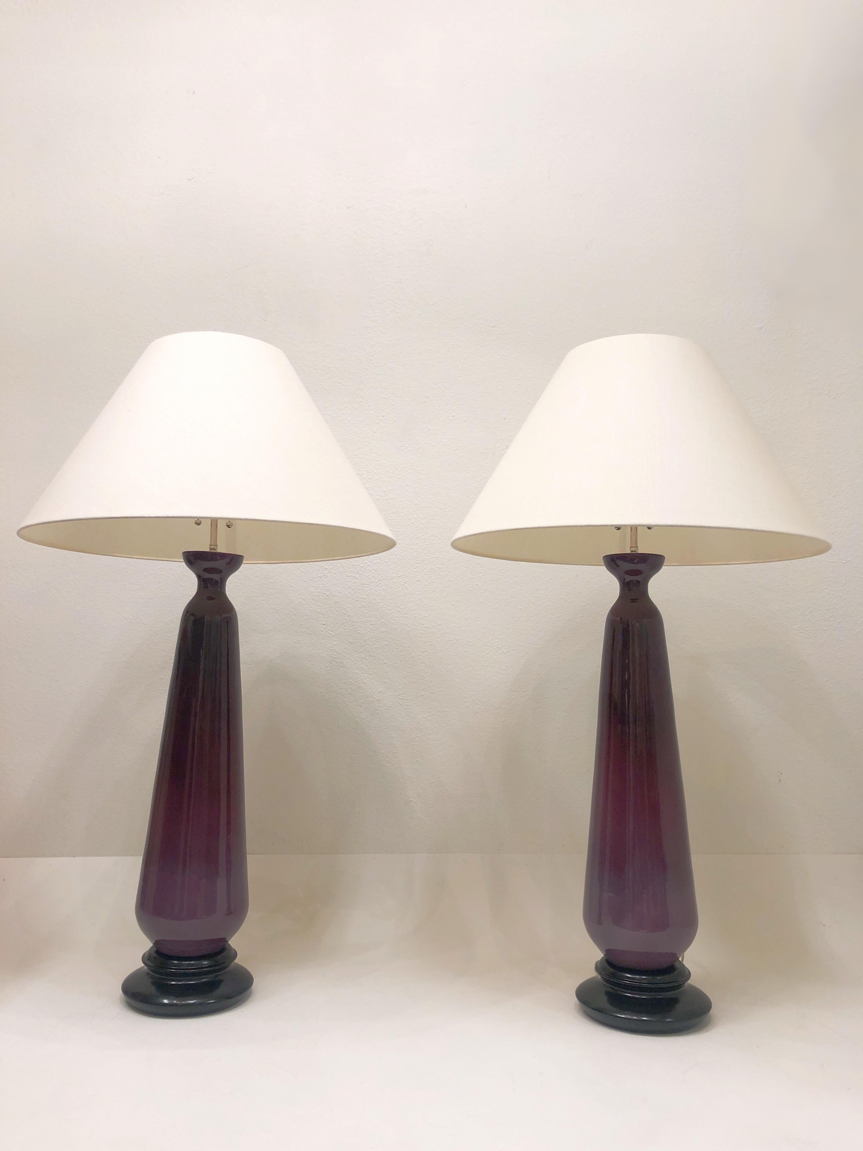 1970’s Pair of large purple glazed ceramic on black lacquered wood base with new polish nickel hardware and vanilla linen shades table lamps. 

Measurements: 45.75” High, 26” Diameter. 
Base: 9” Diameter.