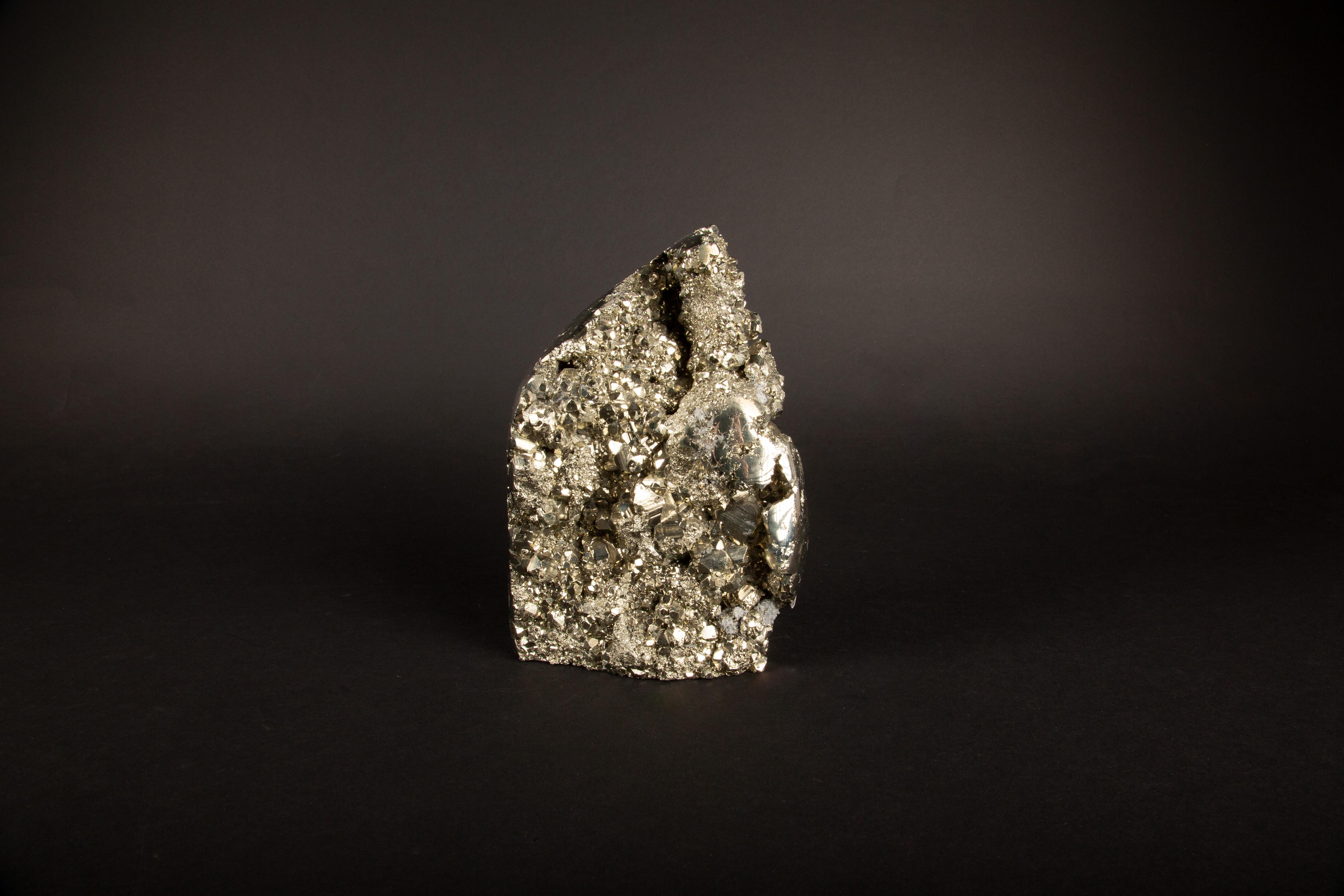 This large Pyrite Specimen stands at an impressive 8.25 inches in height, presenting a magnificent display of nature's artistry. Renowned for its metallic luster and golden hue, pyrite—often called 