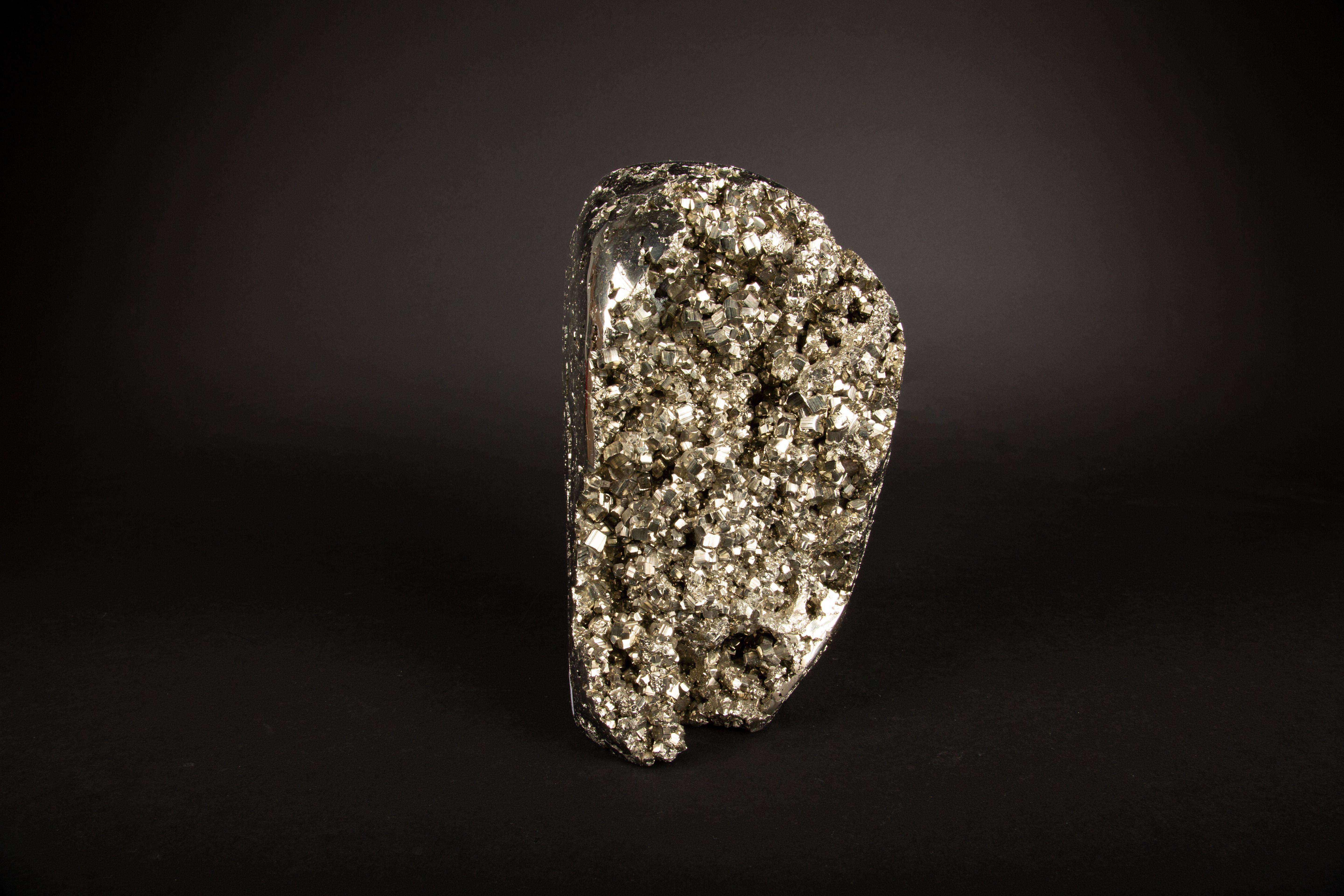 This large Pyrite Specimen stands at an impressive 9.25 inches in height, presenting a magnificent display of nature's artistry. Renowned for its metallic luster and golden hue, pyrite—often called 