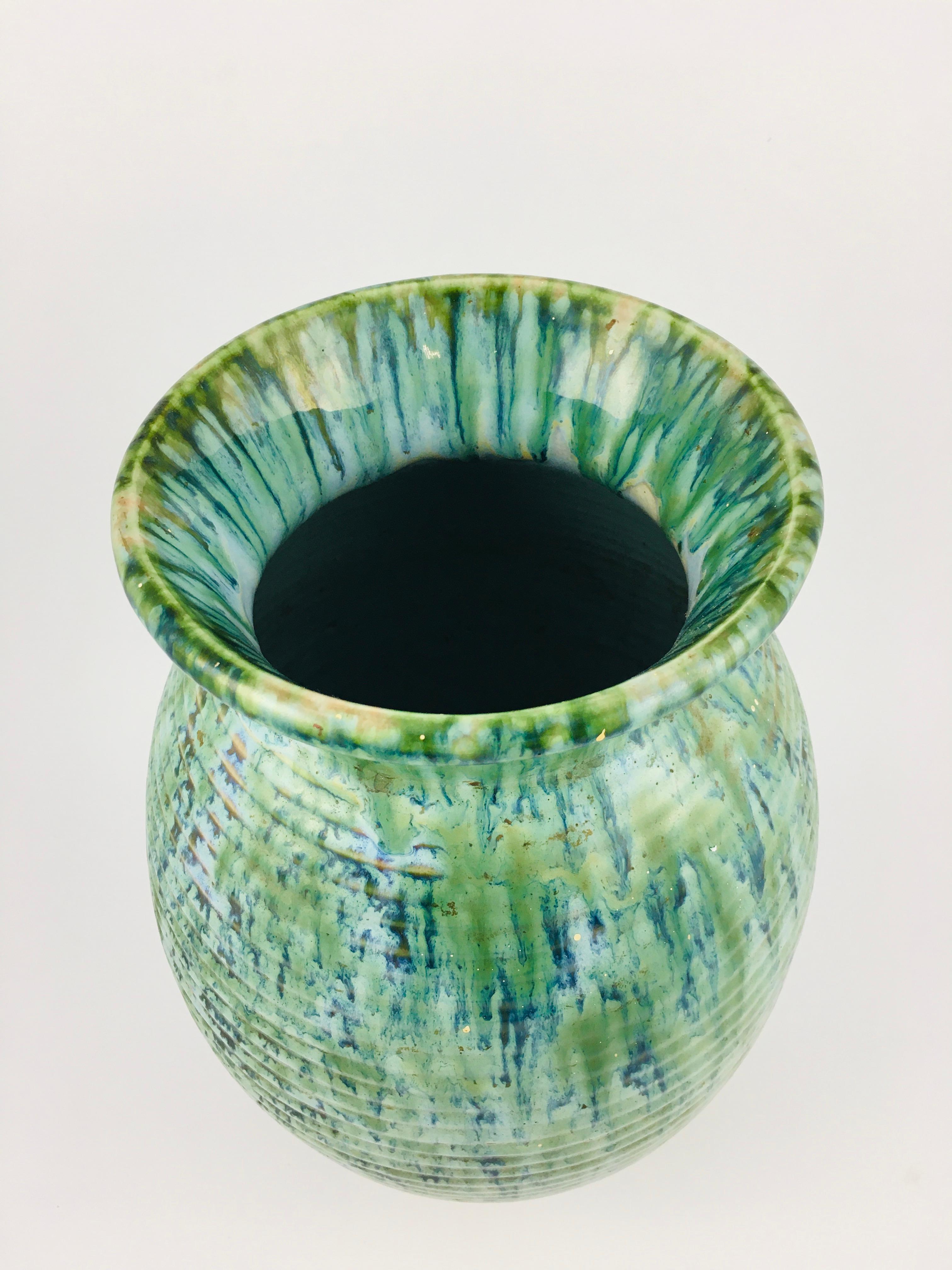 Large pyrogranite vase by Zsolnay, with a special blue and green fused glaze. The wall of a mid-century ceramic urn is ribbed, with glaze applied in several layers with multiple firings. A special green vase, a rare piece from the Zsolnay factory in