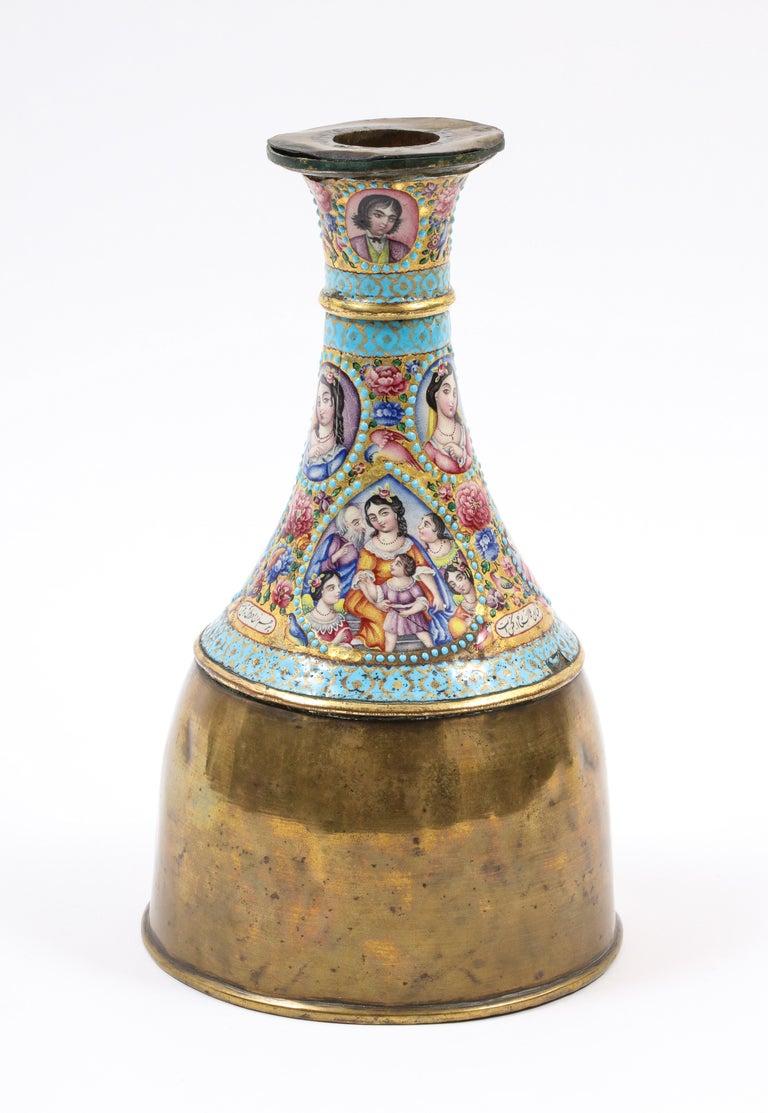 Large qajar and enamelled ghalian section with brass Hookah Base
circa 1900, Persia 

The gold waisted body decorated with European scenes and portraits, each with dotted light blue enamel frames, floral motifs in between, inscriptive cartouches,