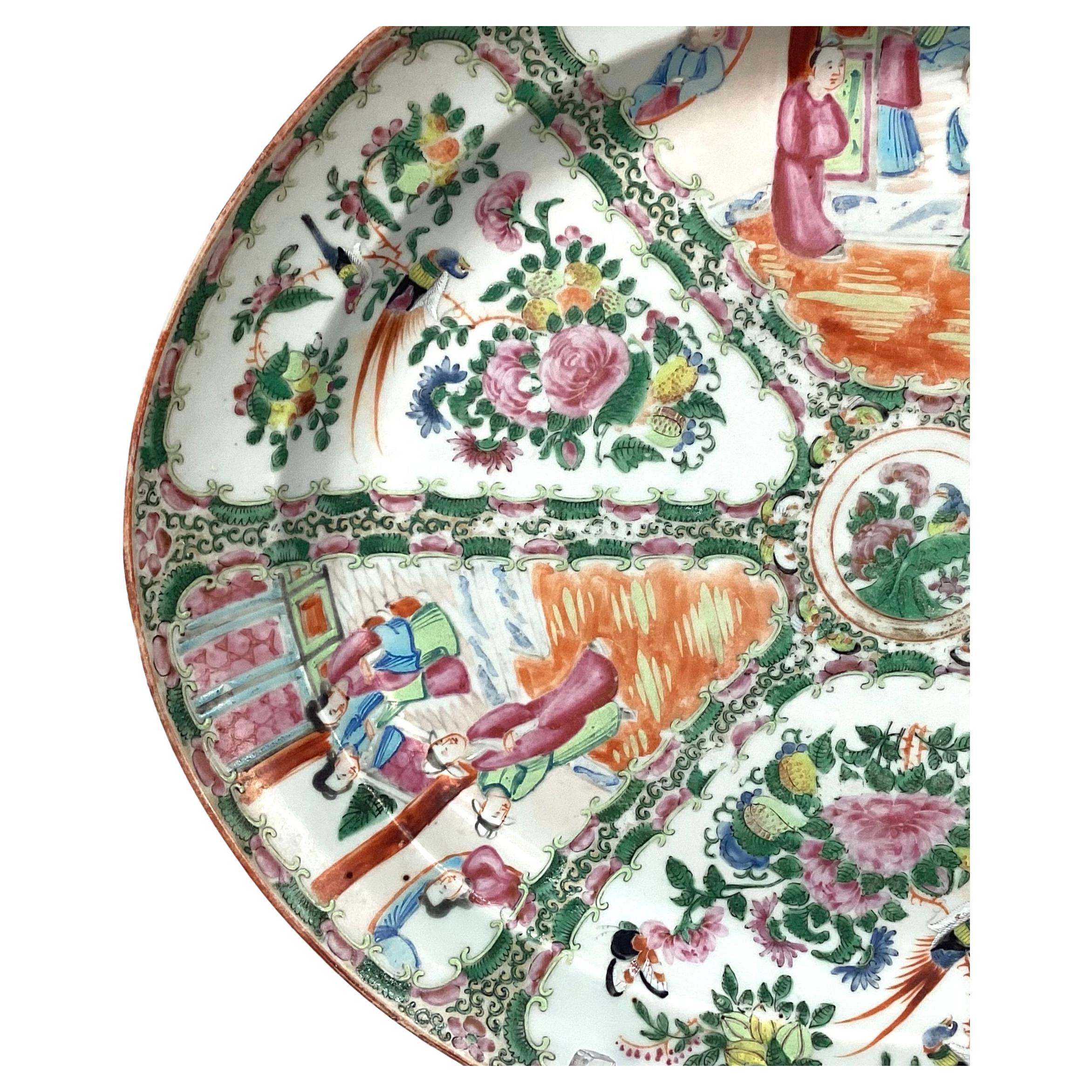 Extra large 18 inch Qing Dynasty Famille Rose Medallion platter, Canton c. 1870, polychrome enameled glazes on a hard-paste porcelain body, with 'orange peel' or ju-pi texture, the center medallion with a single multi-colored bird in a floral garden