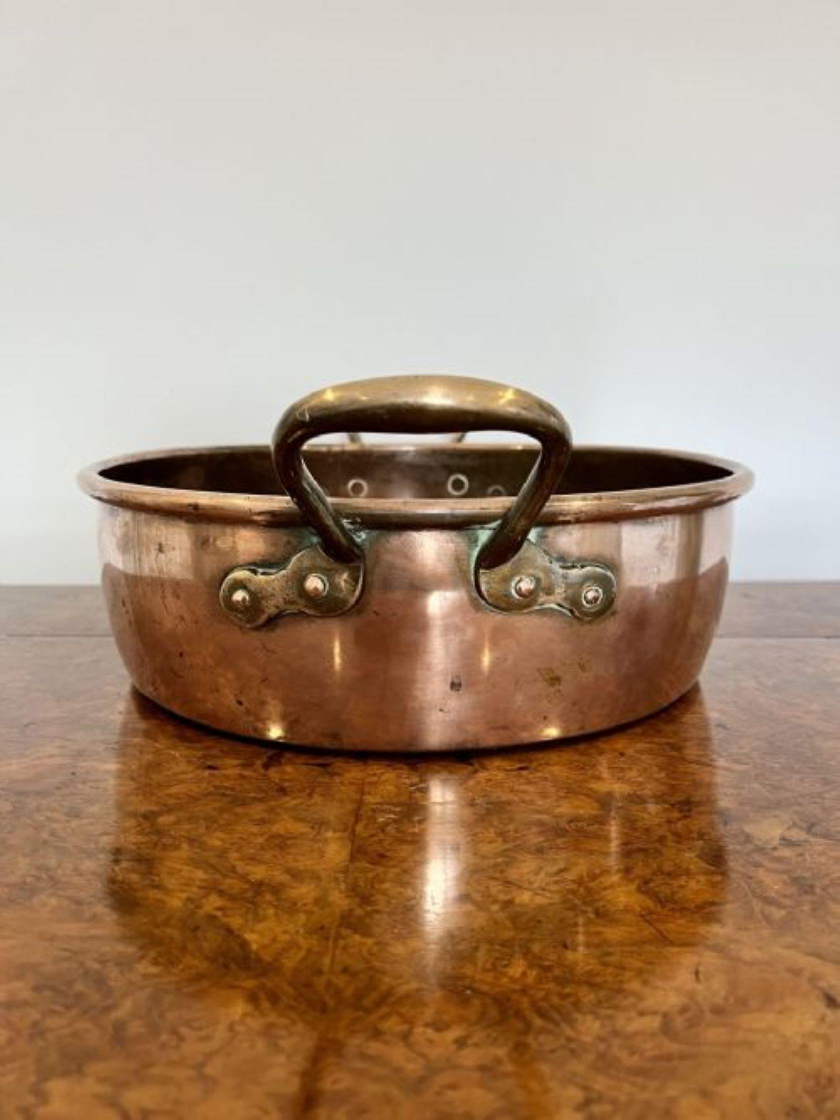 Large quality antique George III copper pan having a quality large antique George III copper pan with shaped handles to both sides. 