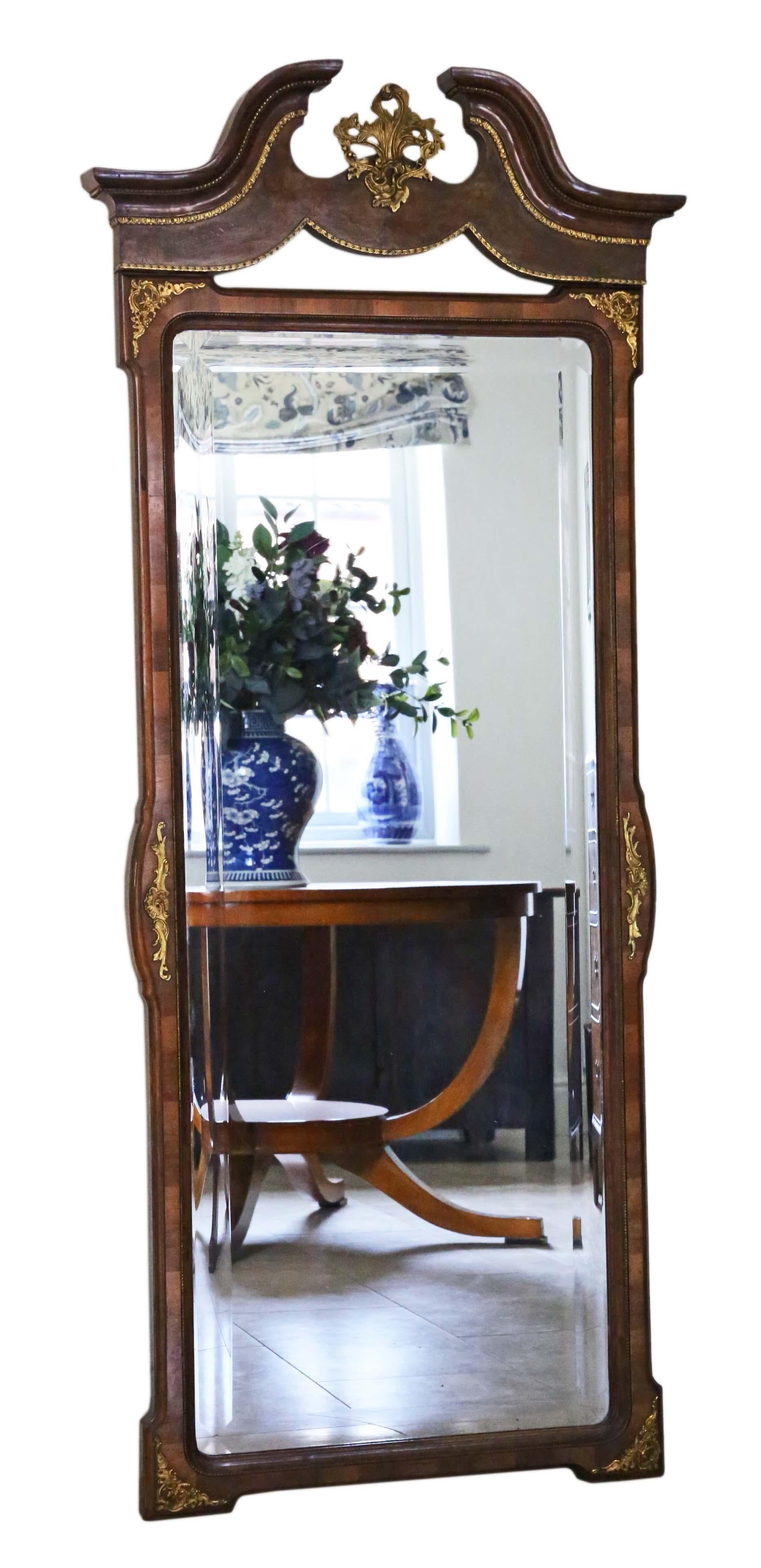 Antique, large, and finely crafted burr walnut and gilt full-height wall mirror from around 1910, emanating a delightful charm and elegance.

This mirror is a rare and captivating find, boasting a well-maintained frame with gilt brass decoration and