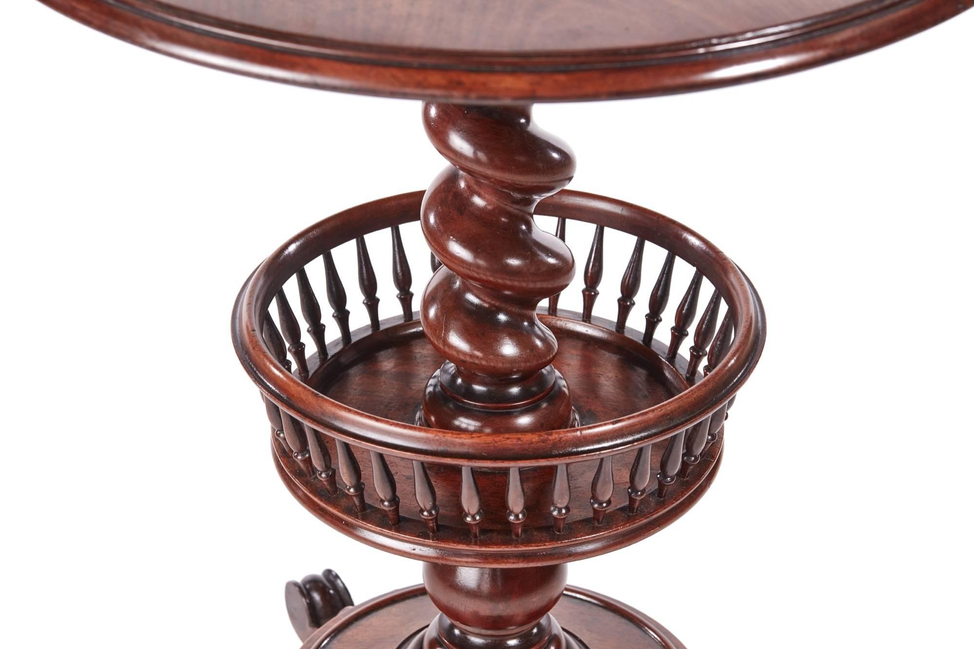 Large William IV mahogany occasional or lamp table with a quality circular top raised upon a substantial barley twist stem with rotating under tier basket having fine turned spindles on a platform base with three scroll feet
Fantastic color and