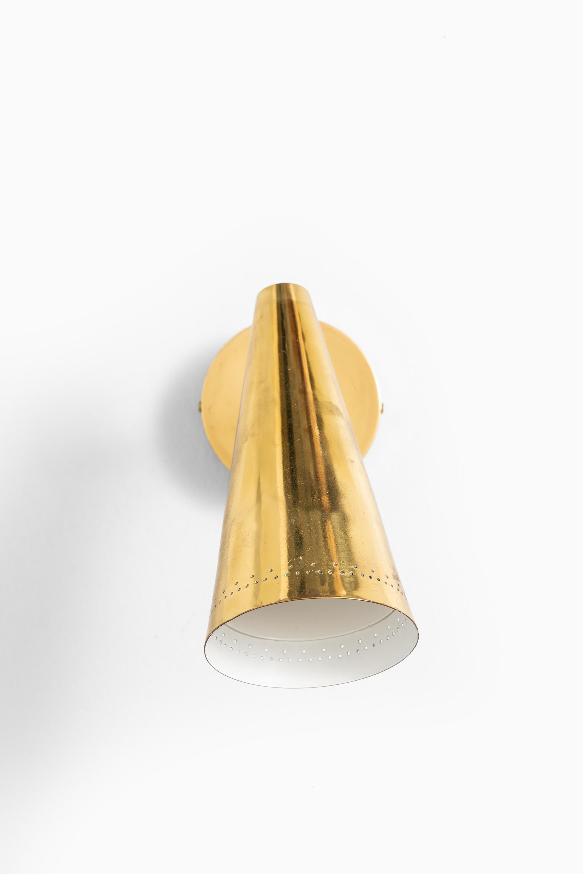 Wall lamps in brass attributed to Lisa Johansson-Pape. Produced in Finland.