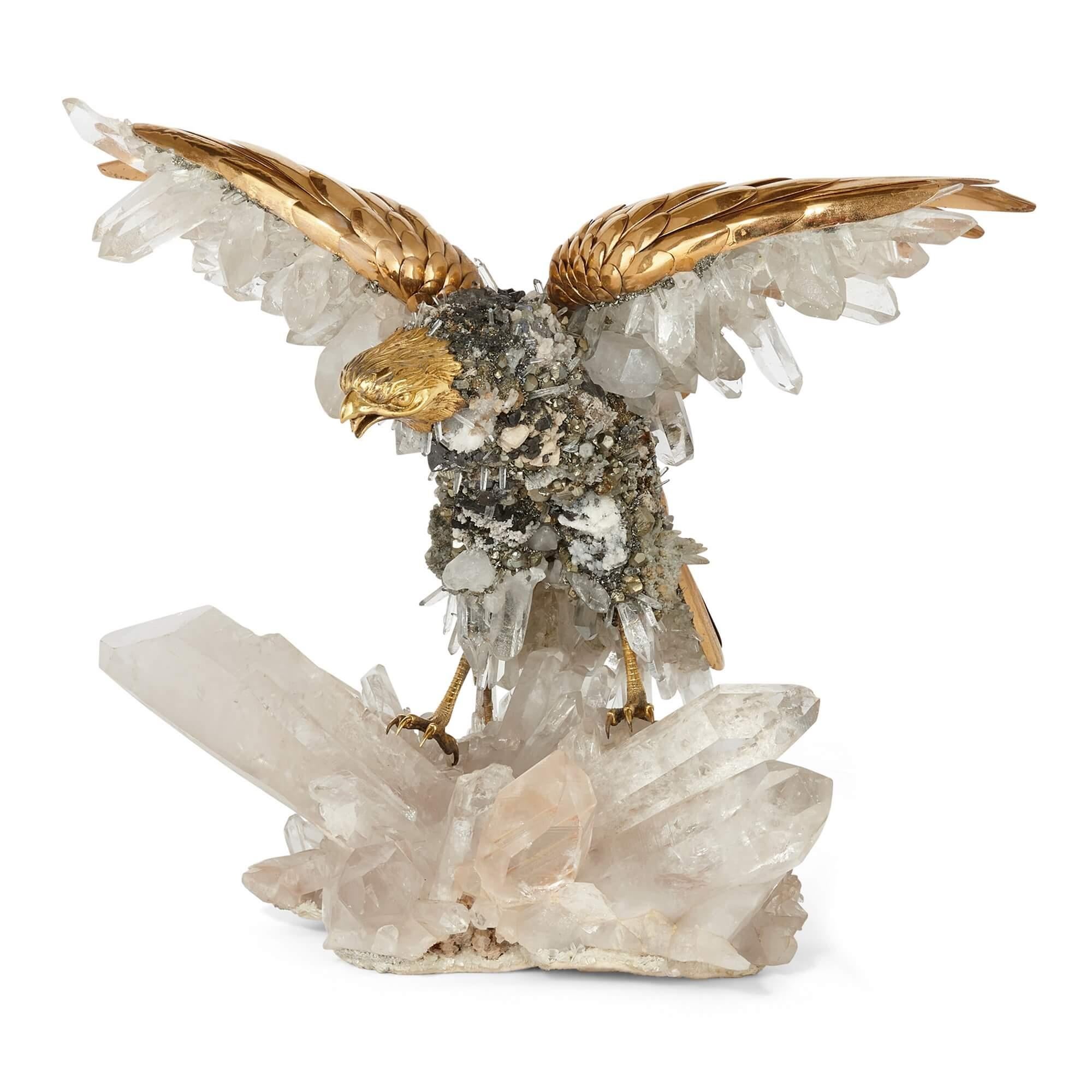 Large quartz crystal and vermeil bird model by Asprey
Swiss, c. 1975
Height 40cm, width 33cm, depth 40cm

This phenomenal piece of sculpture depicts an eagle in motion, taking off from a rocky crag made of stunning quartz crystal. 

The body of the