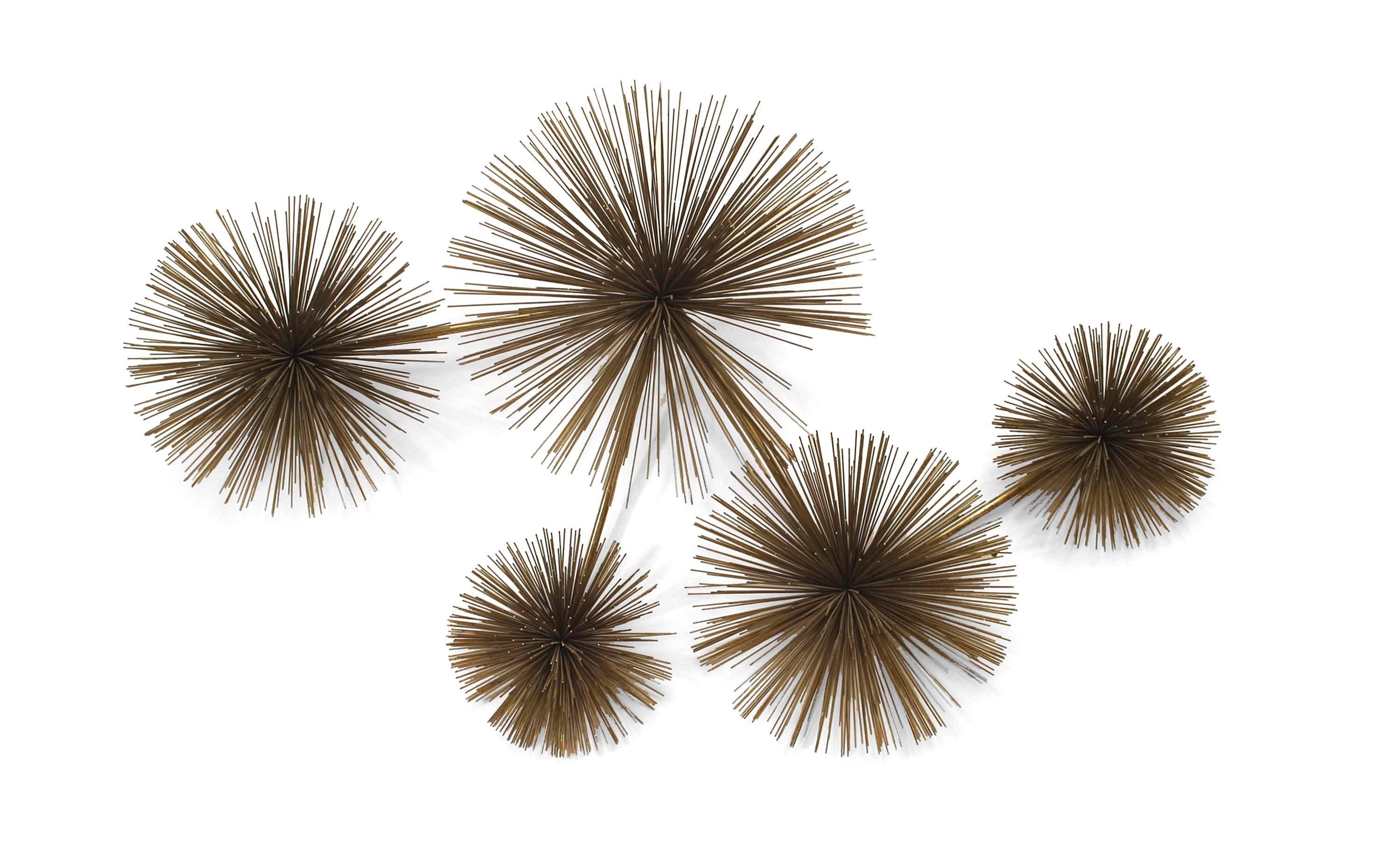 Signed and dated by Curtis Jere (the compound nom de plume of American artists Curtis Freiler and Jerry Fels), this mid-century wall sculpture features an arrangement of five differently sized balls of radiating patinated wire united by a zigzagging