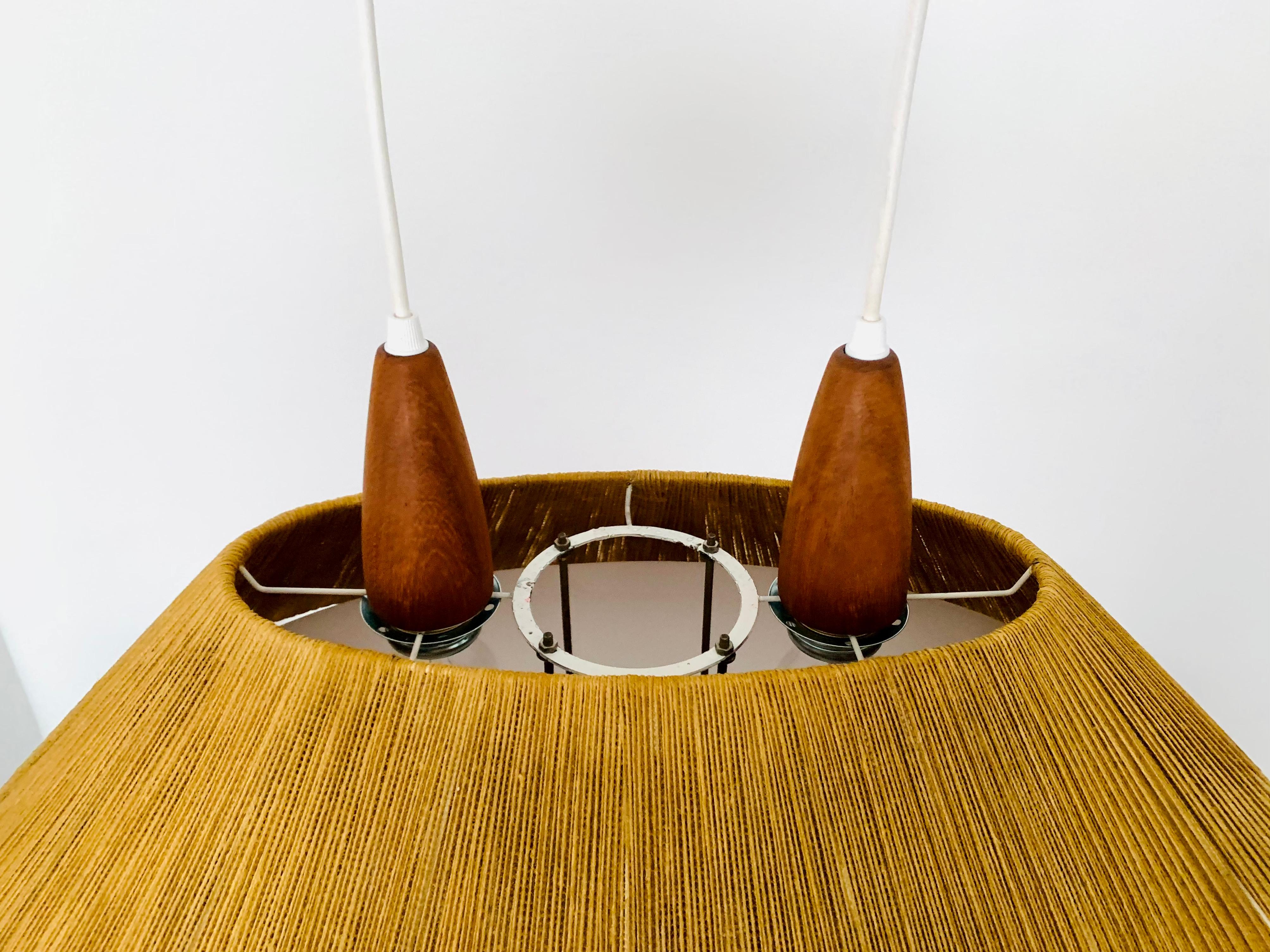 German Large Raffia Bast and Teak Pendant Lamp from Temde For Sale