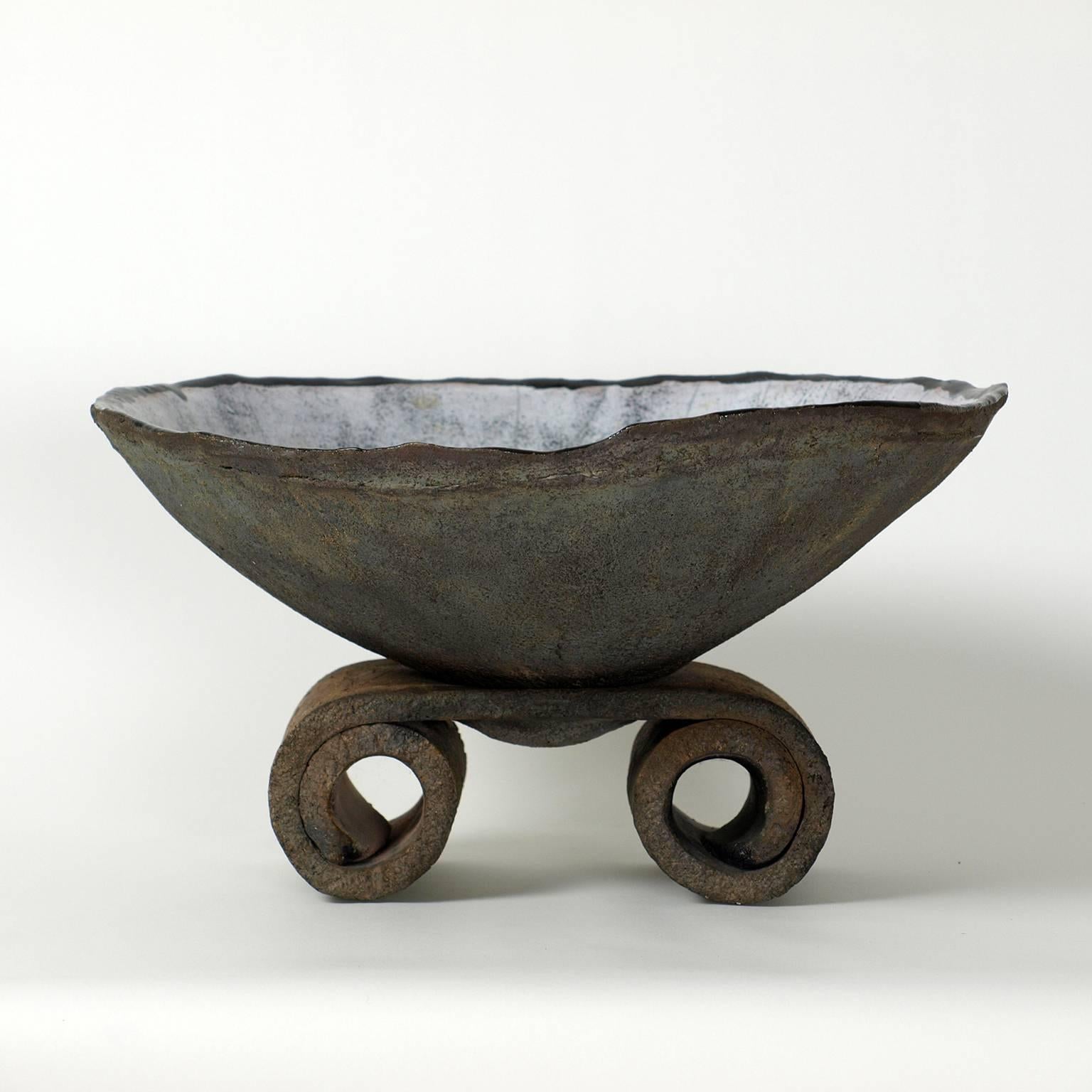Large raku ceramic bowl on pedestal by Gisele Buthod-Garc¸on.
Light gray craqueled glaze inside the bowl with a little gold glaze in the bottom.
Rare and unique beautiful peace.
