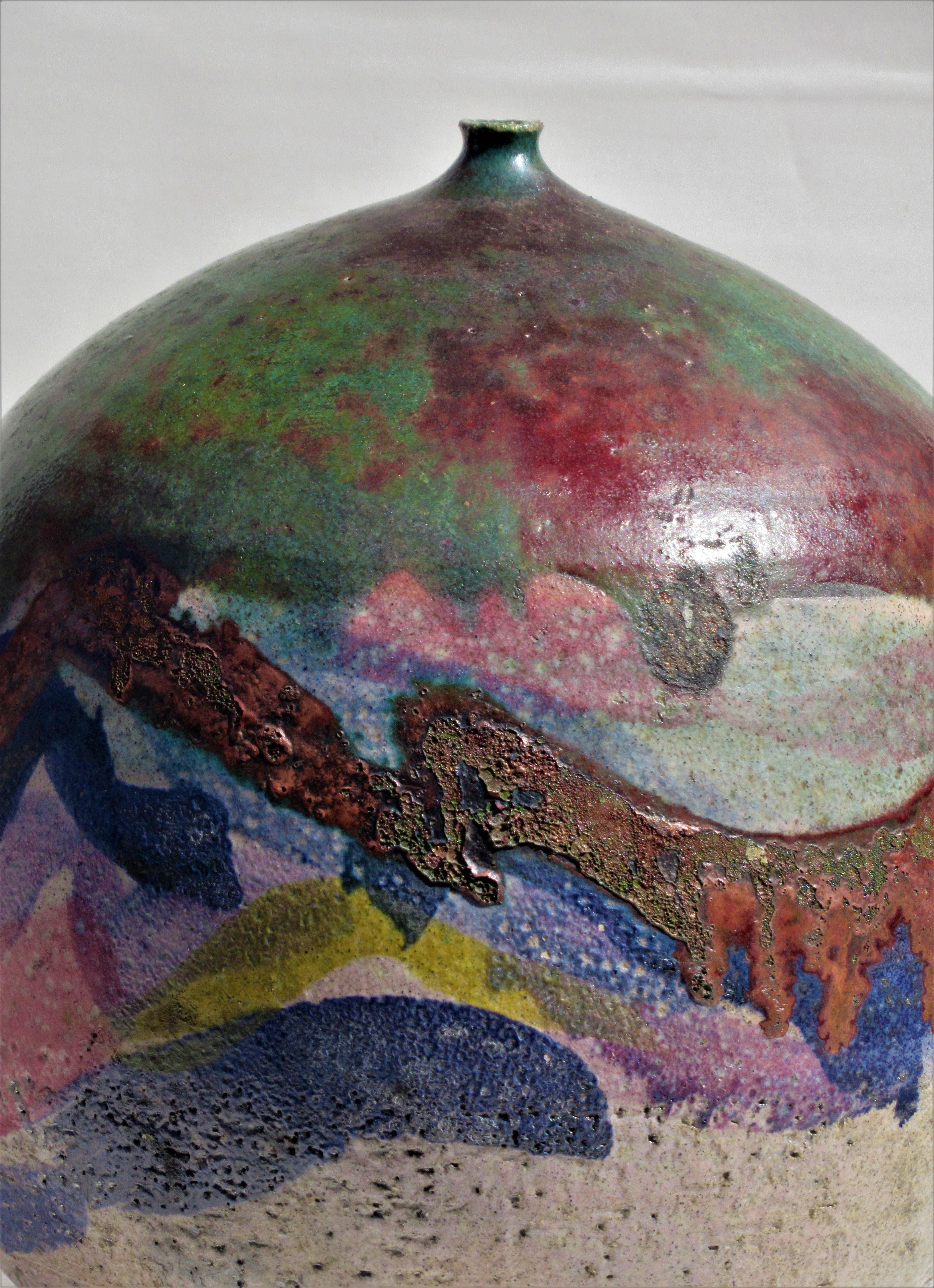 American studio ceramic raku weed pot vase with large bulbous spherical form and exceptionally beautiful textured polychrome glazed surface by Nancy Jurs - circa 1970. Incised signed on underside with initials N J. Look at all pictures and read