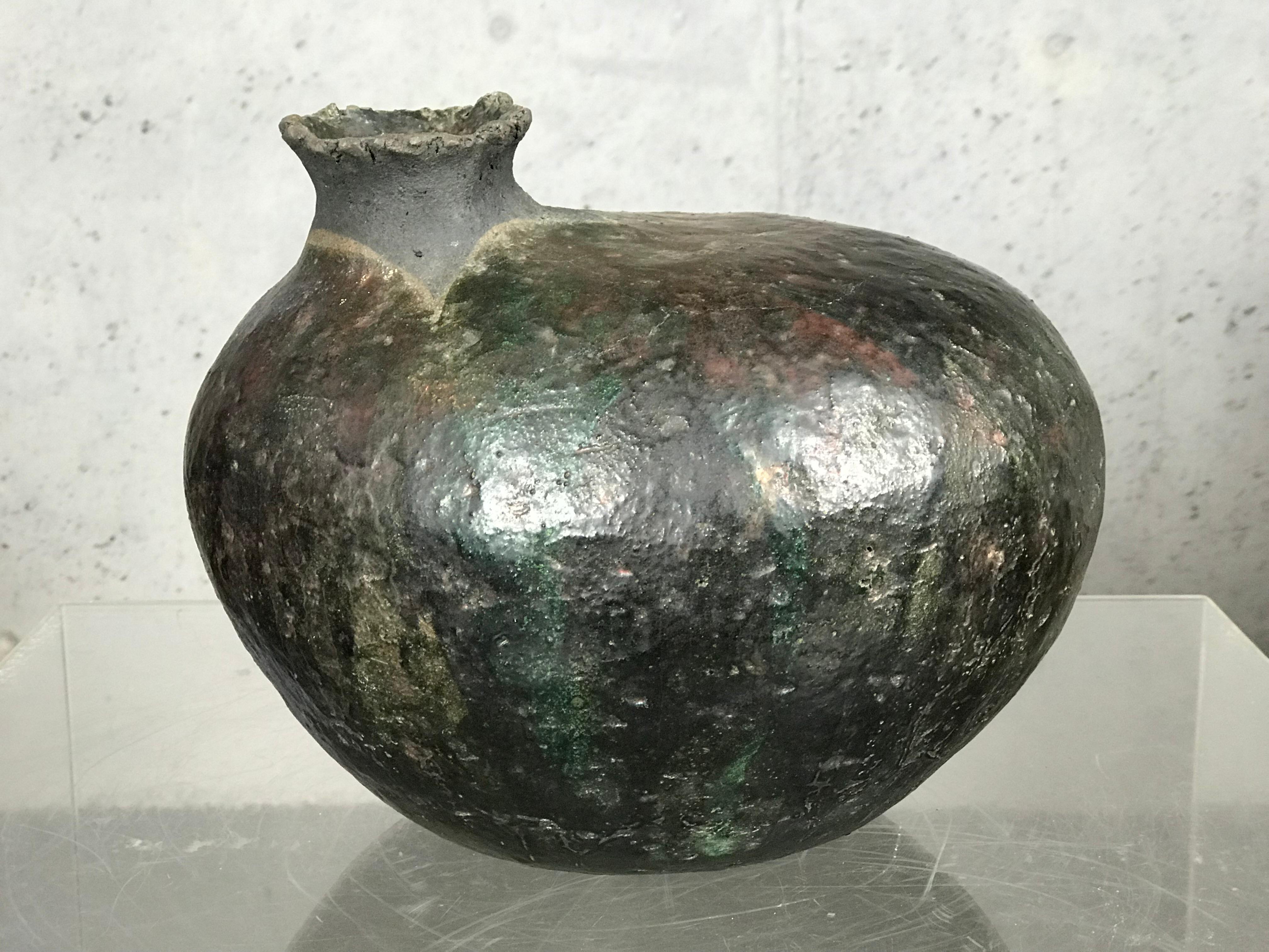 Excellent pottery vessel by the 'Grandma Moses' of Raku Pottery in the Southeast. Charlie Brown's ceramics can be found in many national modern artist publications. This vessel is signed C.B. 1972, and was bought from a residence that Charlie