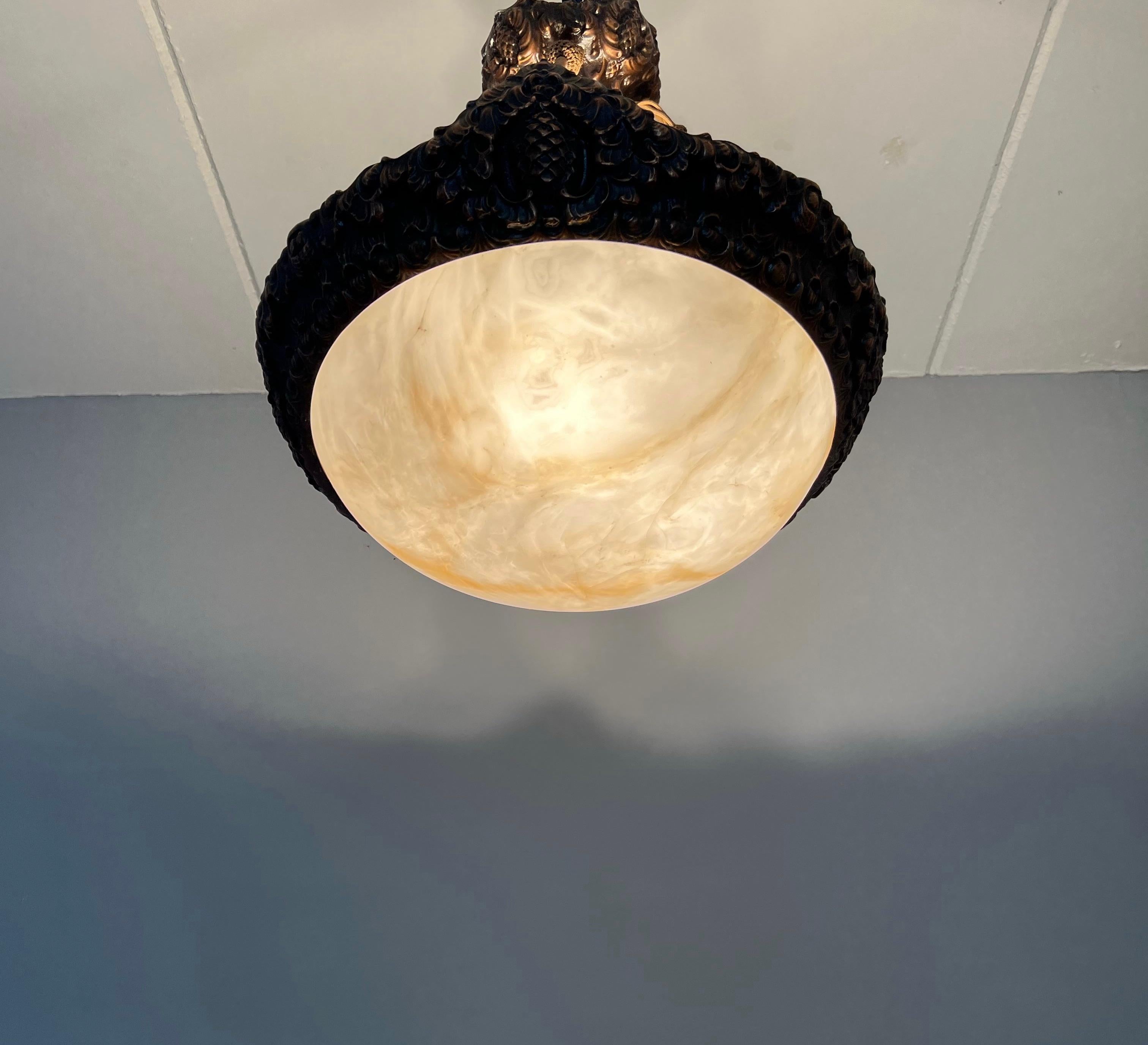 Beautiful copper Arts & Crafts design and alabaster light fixture with original ropes.

With early 20th century lighting being one of our specialities, finding this rare and extraordinary flush mount more than made our day. The combination of the