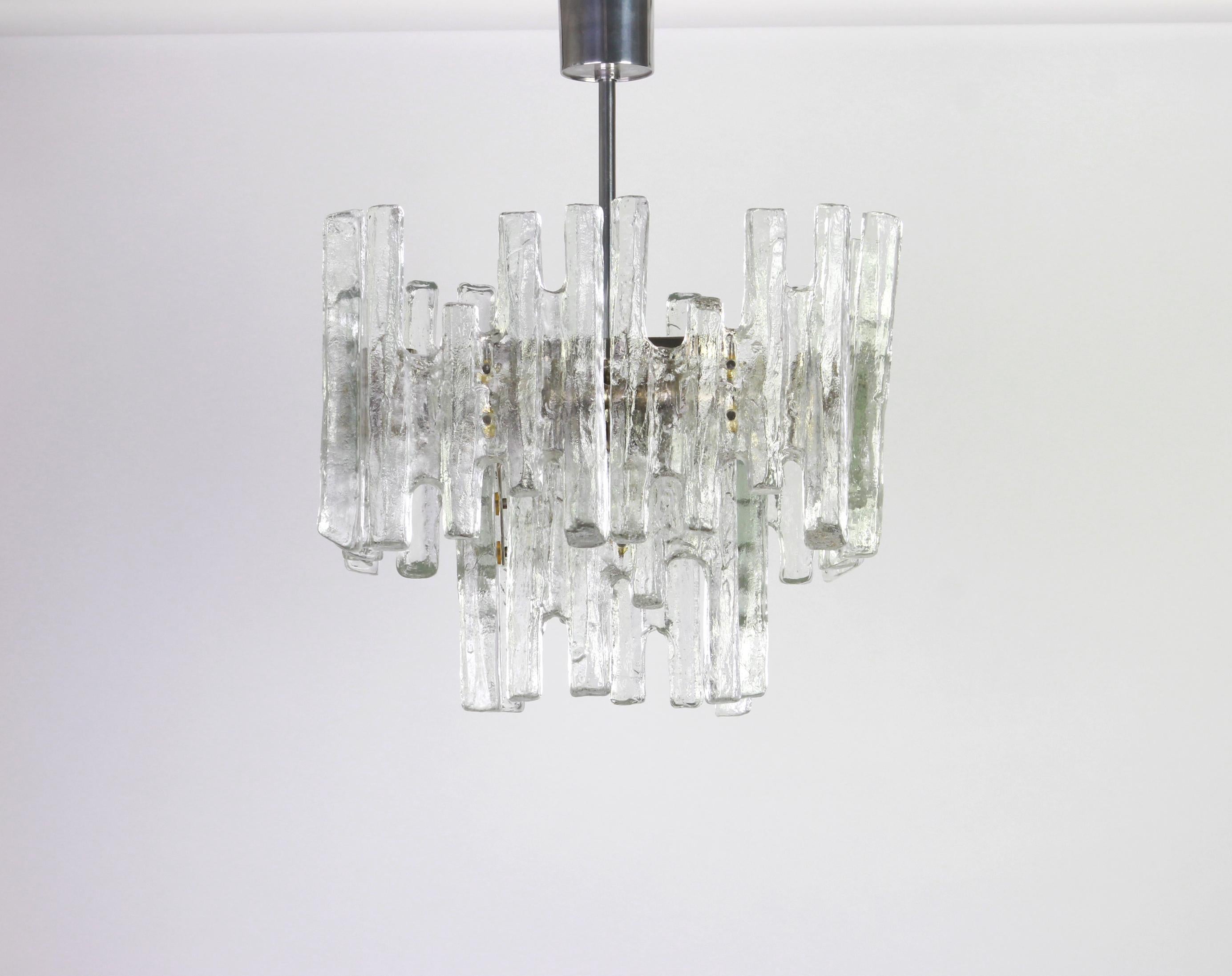 Stunning Murano glass chandelier by Kalmar, 1960s
Two tiers structure gathering 12 structured glasses, beautifully refracting the light very heavy quality.

High quality and in very good condition. Cleaned, well-wired and ready to use. 

The