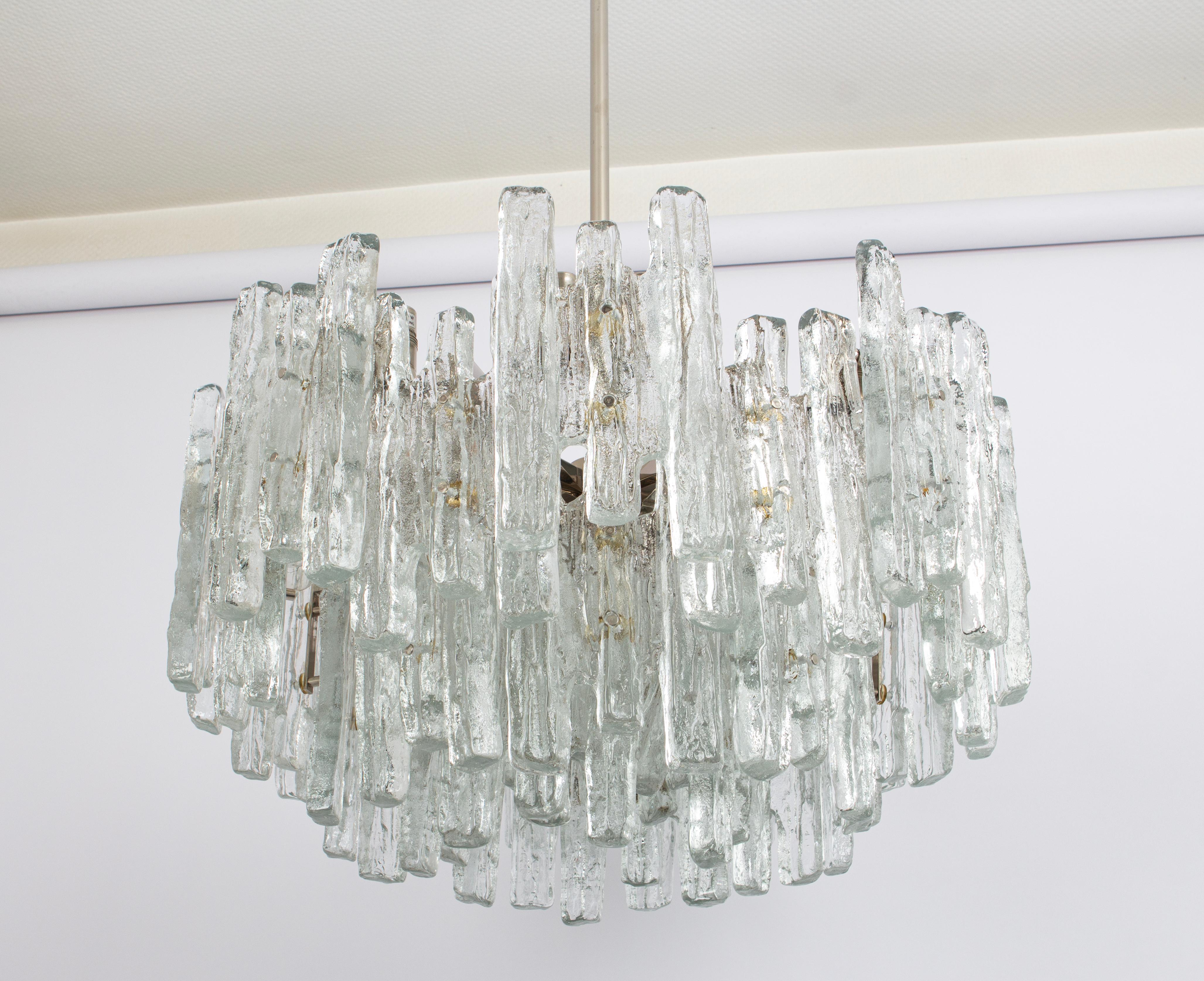 Stunning Huge Murano glass chandelier by Kalmar, 1960s
Four tiers structure gathering many structured glasses, beautifully refracting the light very heavy quality.

High quality and in very good condition. Cleaned, well-wired and ready to use. 

The