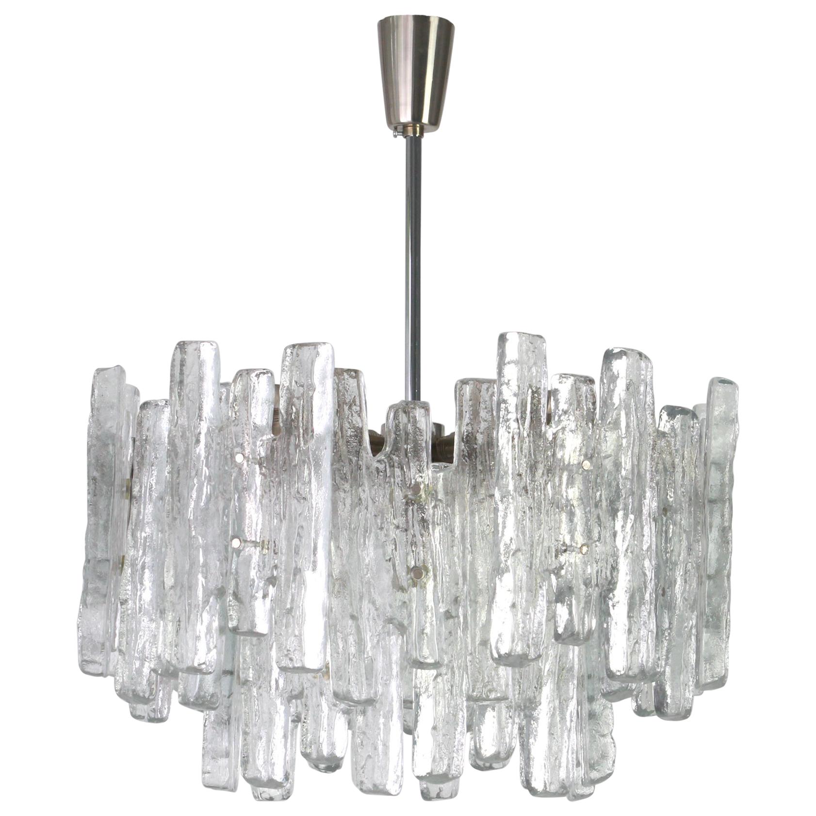 Stunning Murano glass chandelier by Kalmar, 1960s
Three tiers structure gathering many structured glasses, beautifully refracting the light very heavy quality.

High quality and in very good condition. Cleaned, well-wired and ready to use. 

The