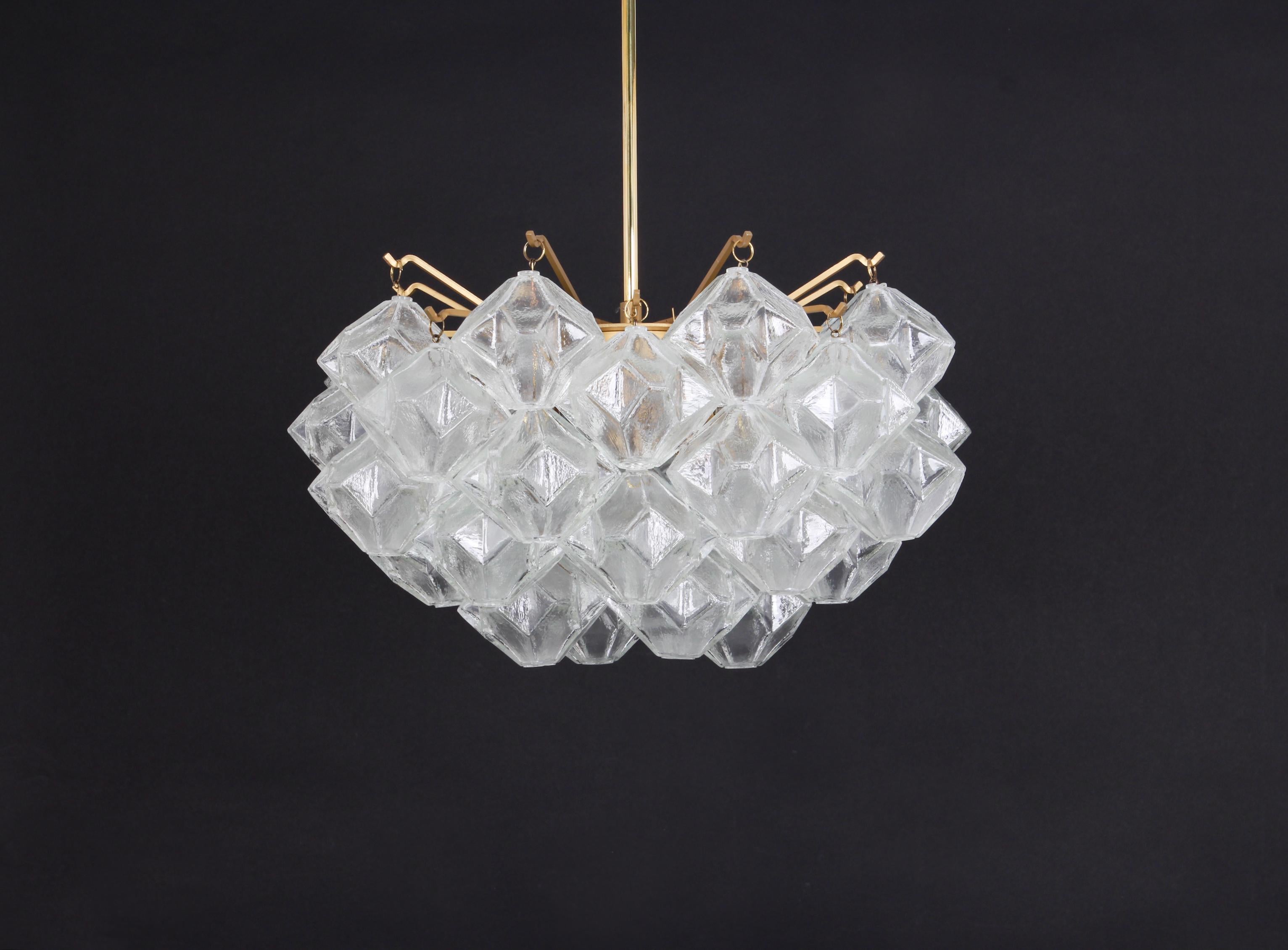 Wonderful rare chandelier with onion shaped glasses. 31 hand blown glasses suspended on gold painted metal frame and brass center rod.
Best of design from the 1960s by Kalmar, Austria. High quality of the materials.

Sockets: 4 x E27 Standard