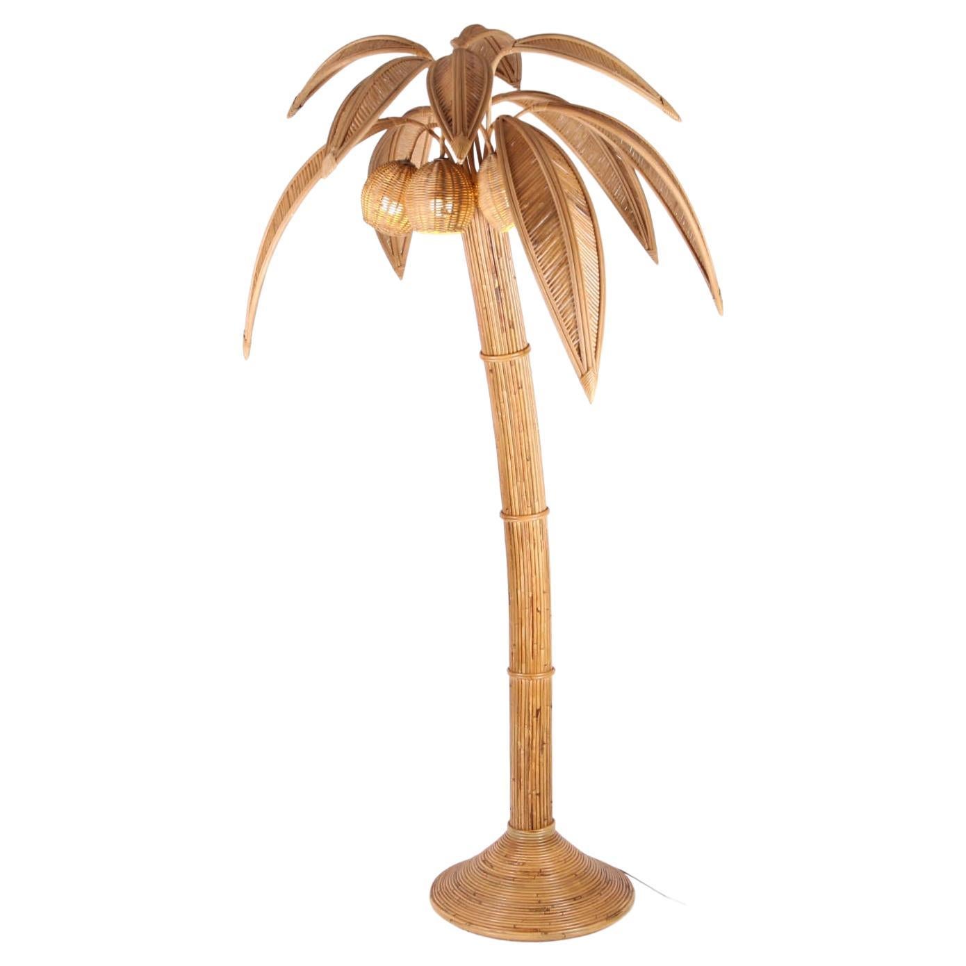 Rattan coconut tree/ palm tree floor lamp with 10 adjustable palms that come off for the shipping and 3 lights in the coconuts. Typical of the seventies, this is the absolute tropical decoration. High quality work entirely hand made. Excellent