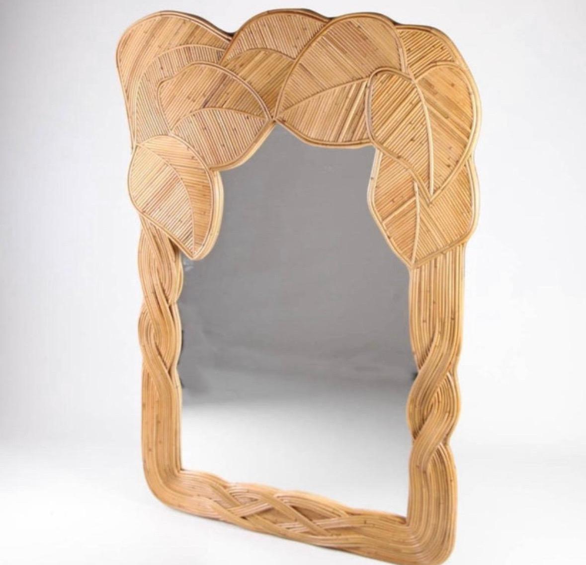 Amazing and large rattan mirror with foliages and intertwined vines patterns.
Very decorative, this mirror is the result of a high quality all hand made work.
Beautiful patina, excellent condition, very unique.
