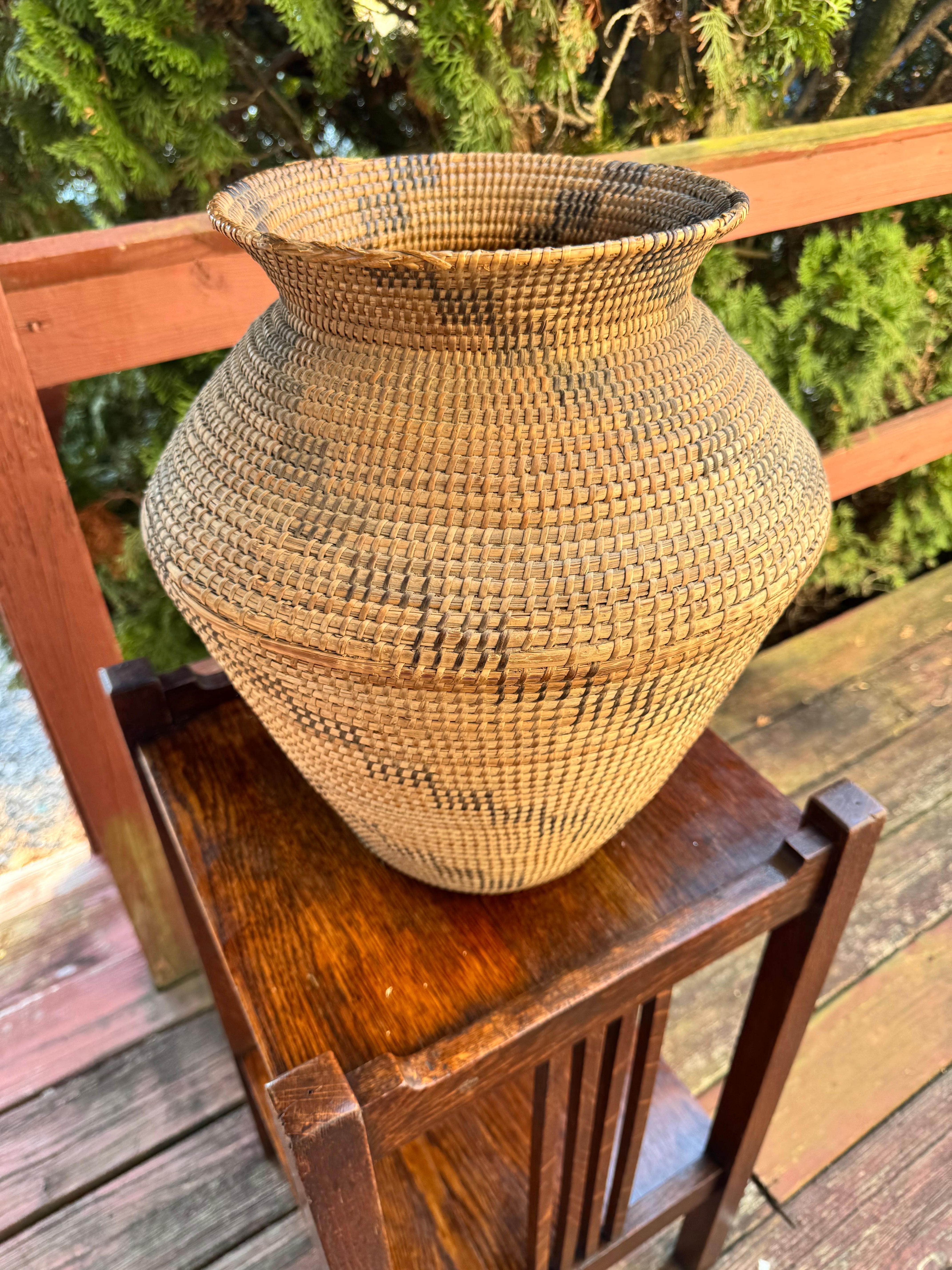 Large Rattan Native American Basket - W7416

This is a large native American woven basket in very good condition. Although there is no marking on the item itself, we believe it was made Mid-20th Century. There are no apparent repairs or replaced