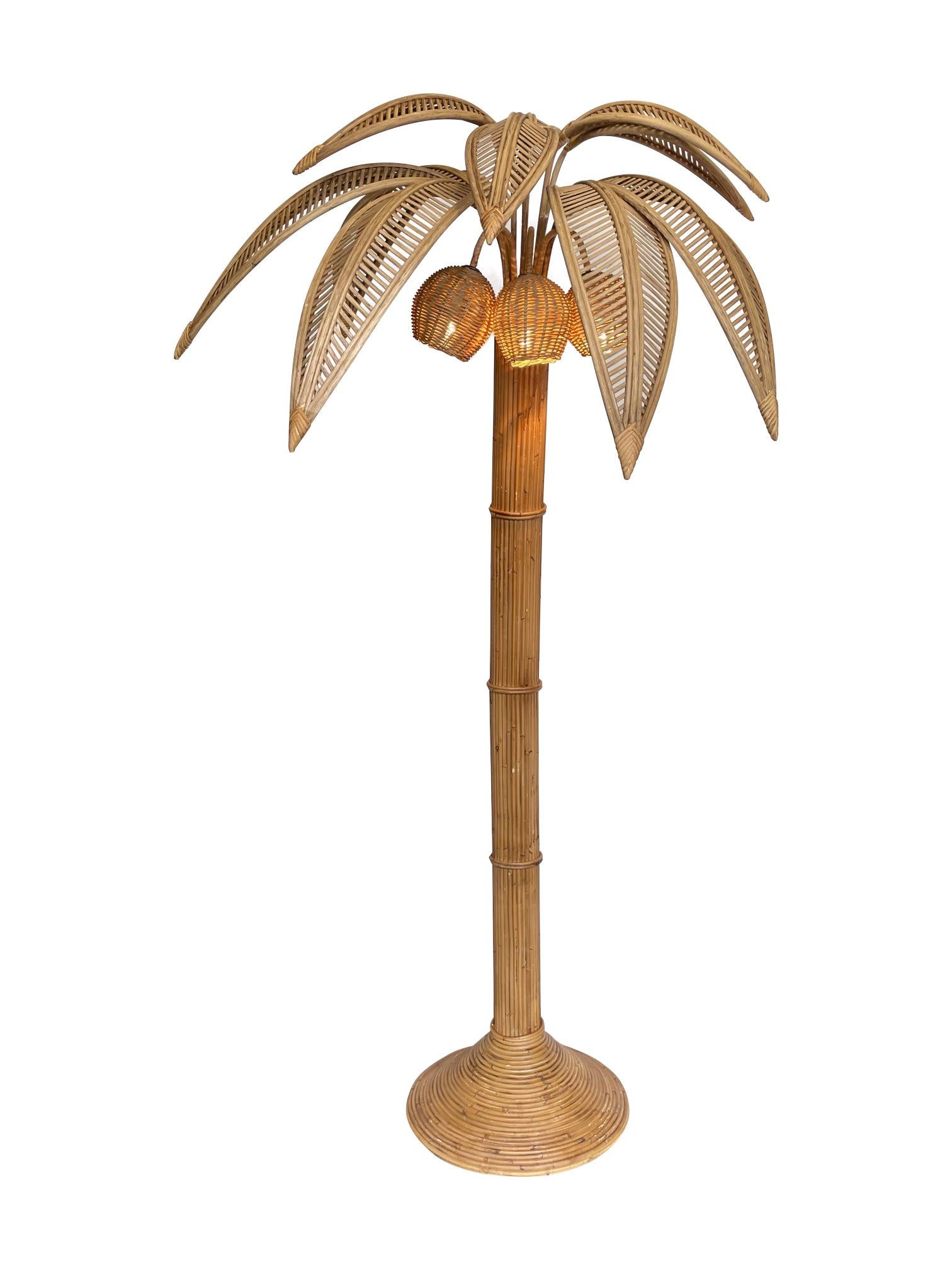 A large rattan palm tree floor light, with bulbs in the three coconuts in the style of Mario Lopez Torres.