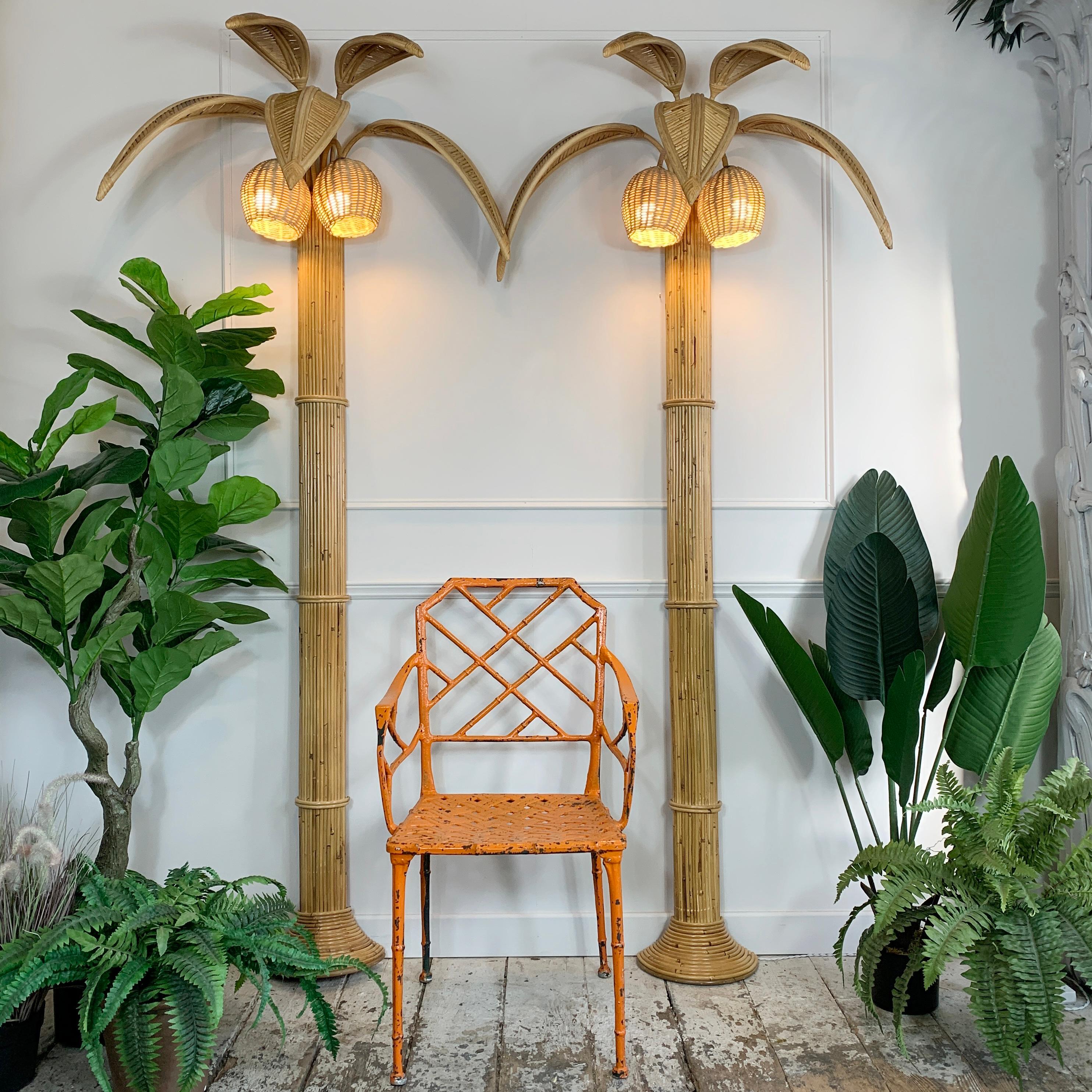 An exceptional pair of wall lights, very much in the manner of Mario Lopez Torres and Vivai Del Sud, these are floor standing wall lights of huge proportions, each with a pair of ‘coconut’ lamp holders, and a canopy of tall palm leaves. Dating to