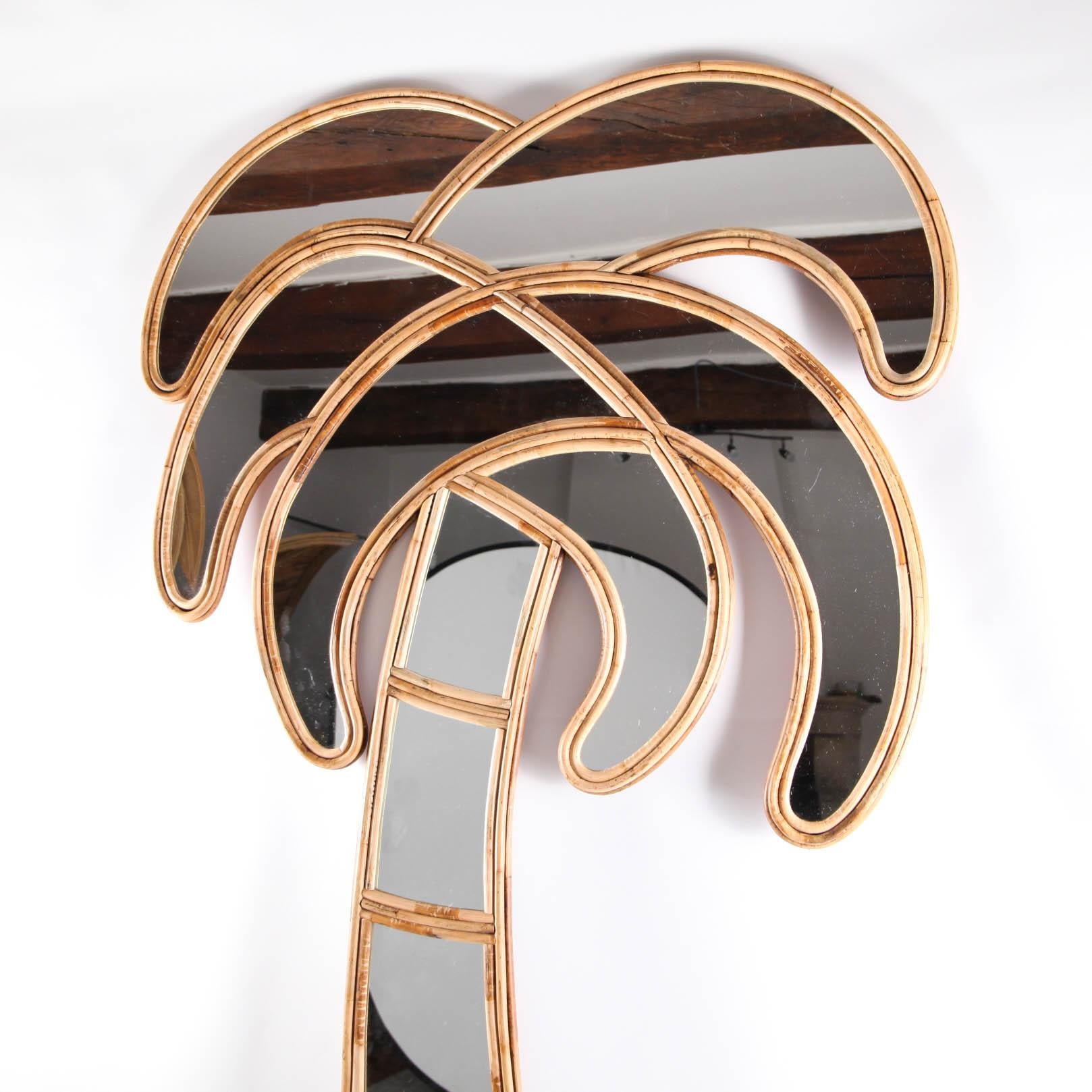 Large hand made rattan palm tree mirror.
Also available in a set of 2 (left and right).