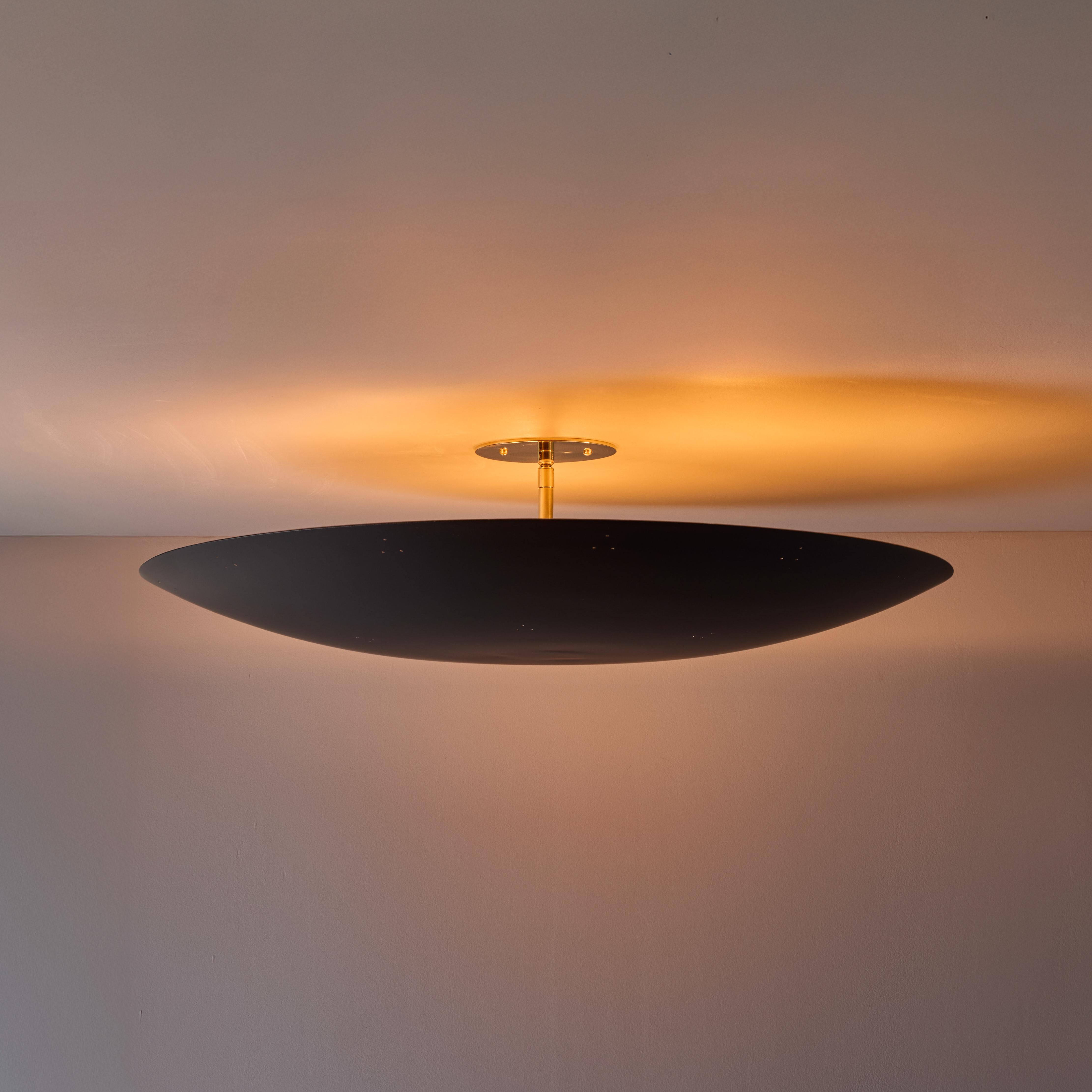 Large Raul Reyes 'Rey 26' Perforated Dome Ceiling Lamp in Black.

Hand-fabricated in Los Angeles, these highly refined ceiling lamps are reminiscent of the iconic mid-century Finnish designs of Paavo Tynell and Lisa Johansson Pape. Executed in black