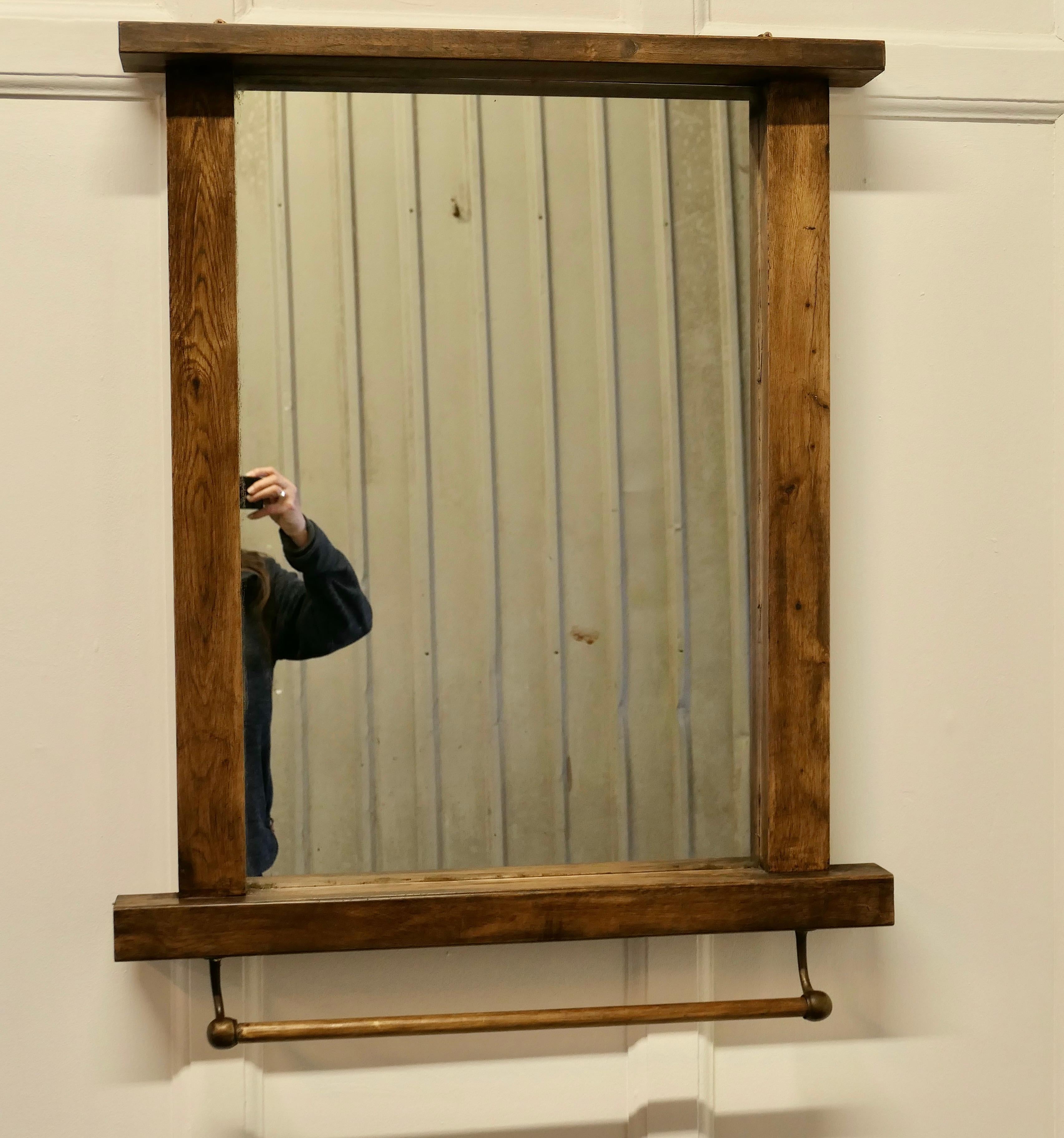 Large reclaimed oak cloakroom wall mirror with towel rail

This is a very useful piece, the large oak mirror frame has brass brackets holding a towel hanging rail at the bottom
The mirror and frame are both in good condition
The mirror is 36”