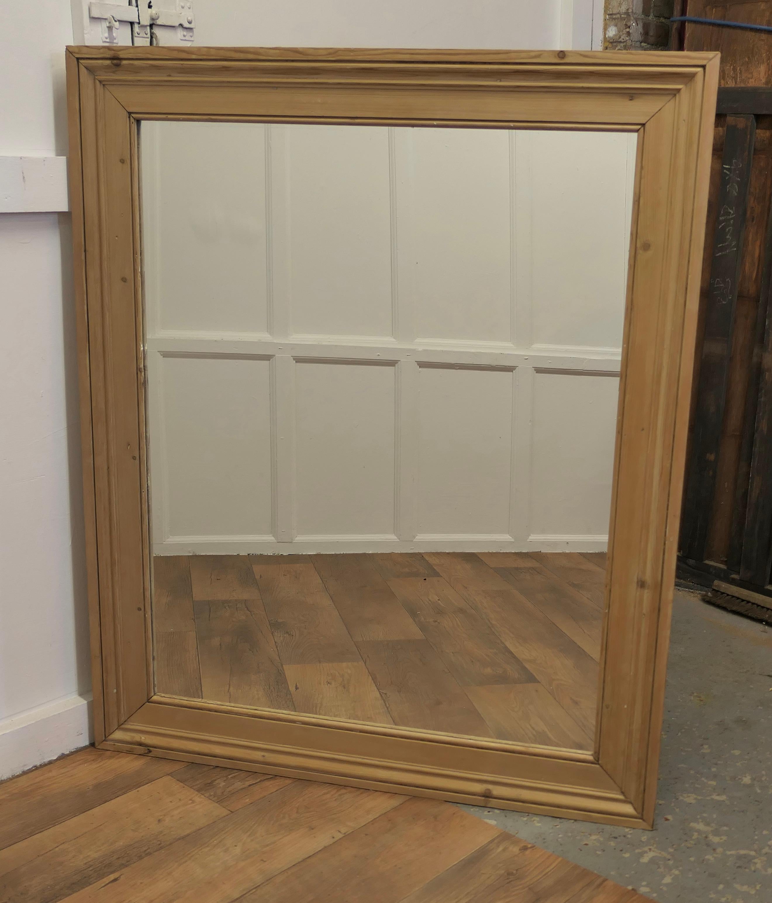 Large Reclaimed Pine Wall Mirror with a Moulded Pine Frame

The Mirror has a simple moulded 5” wide Pine Frame, this has a chunky attractive look 
The Glass is new, good large mirror will always add light and interest to a room and this one has