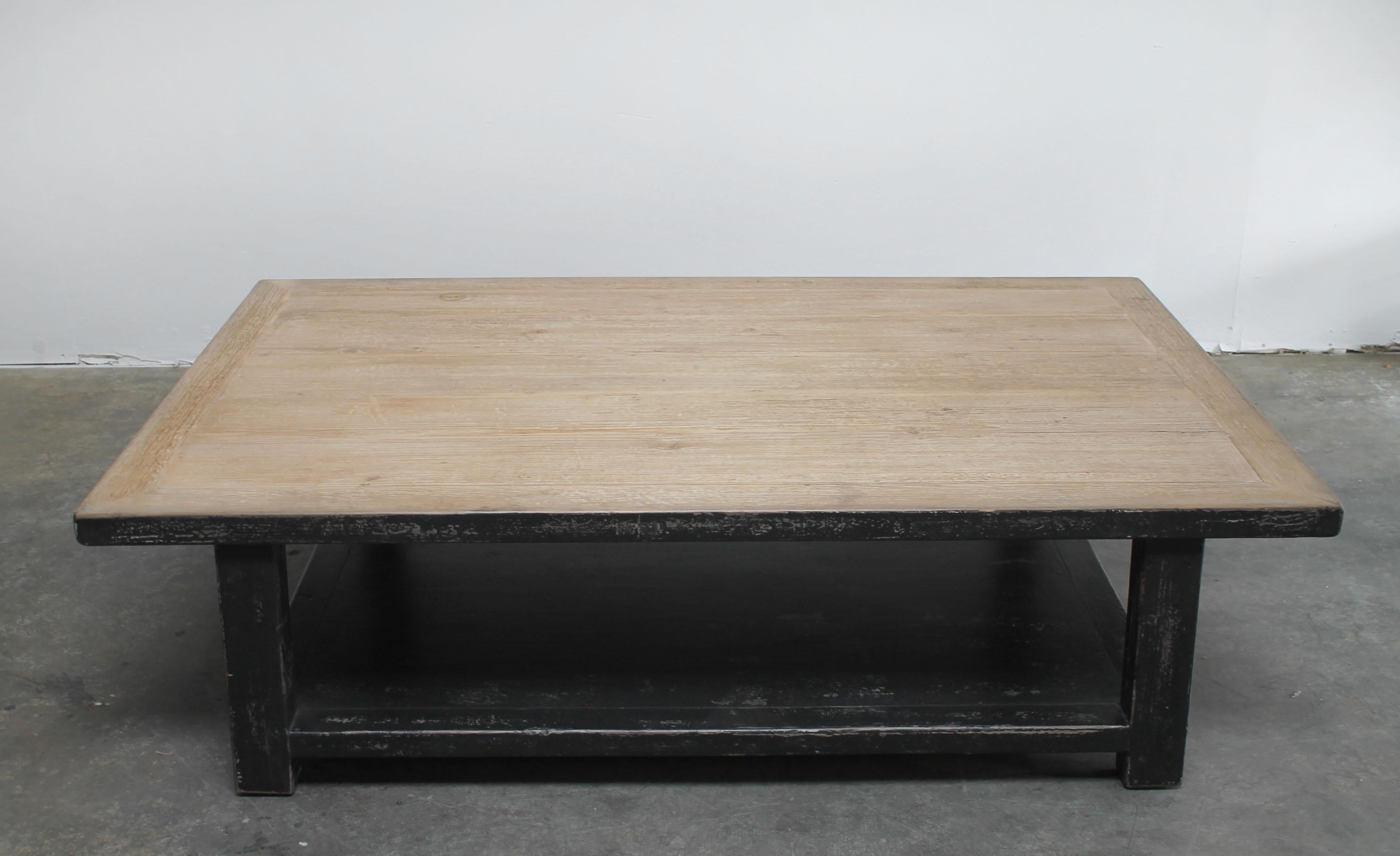 Large reclaimed pine wood coffee table with distressed black finish 
Size: 67 x 43 x 17
The top has a natural reclaimed pine wood finish, each table with have different characteristics, this is part of the reclaimed wood look.
The legs and base