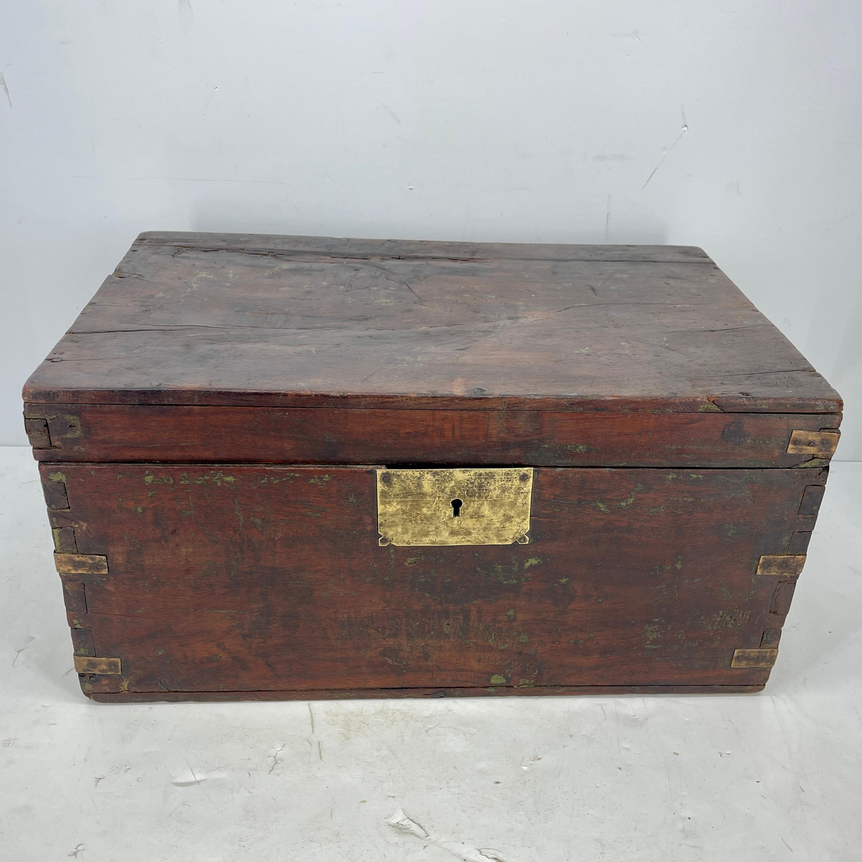 Large rectangular antique wooden Campaign chest with brass hardware 
Brass lock has unknown signed makers mark on it.
 