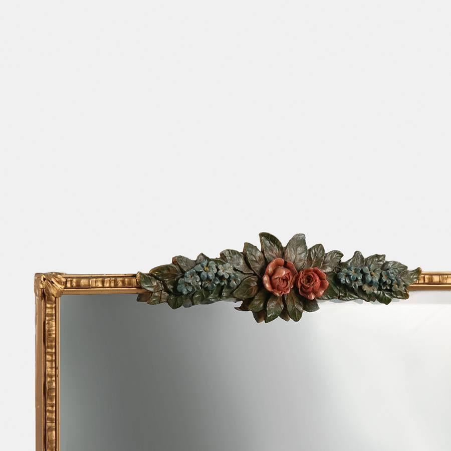 A large rectangular Barbola mirror. Barbola mirrors were hugely popular in England at the turn of the last century.

 Barbola is gesso work decoration using gesso paste that was used as a lighter substitute for carved wood.