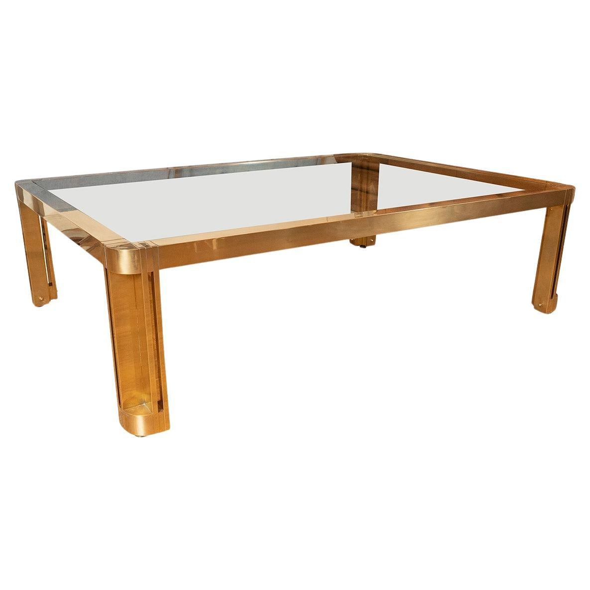 Large rectangular brass and glass coffee table with incised design For Sale