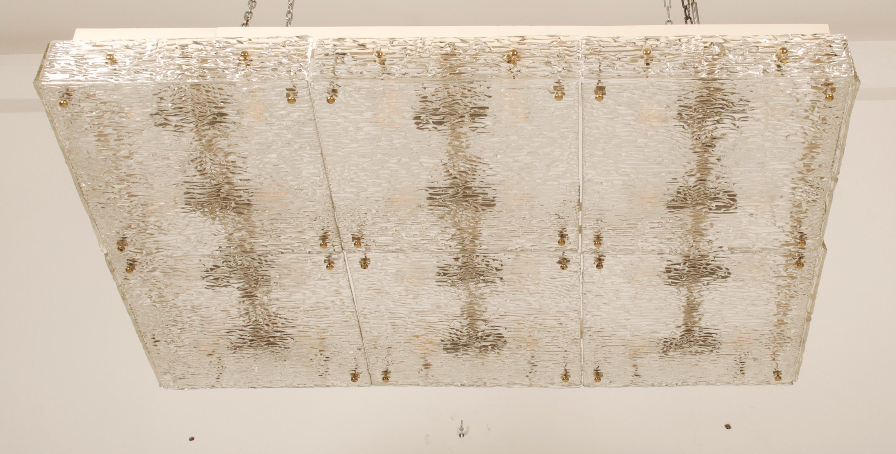 Steel/brass frame painted with glass textured parts manufactured by J.T. Kalmar in Vienna in the 1950s.
The lamp is fitted with 24 E27 bulbs.

  