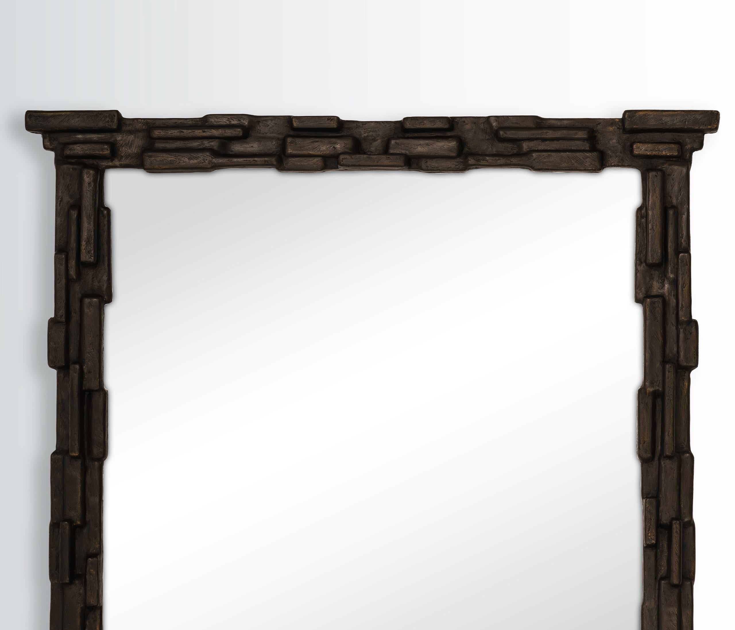 Fragments of metal, shaped and assembled in line with a secret sense of order. Each Fractal Mirror is artfully hand-sculpted in plaster, sensuality expressed in its patina – a blend of rough and velvety texture. 

Each piece is unique due to its