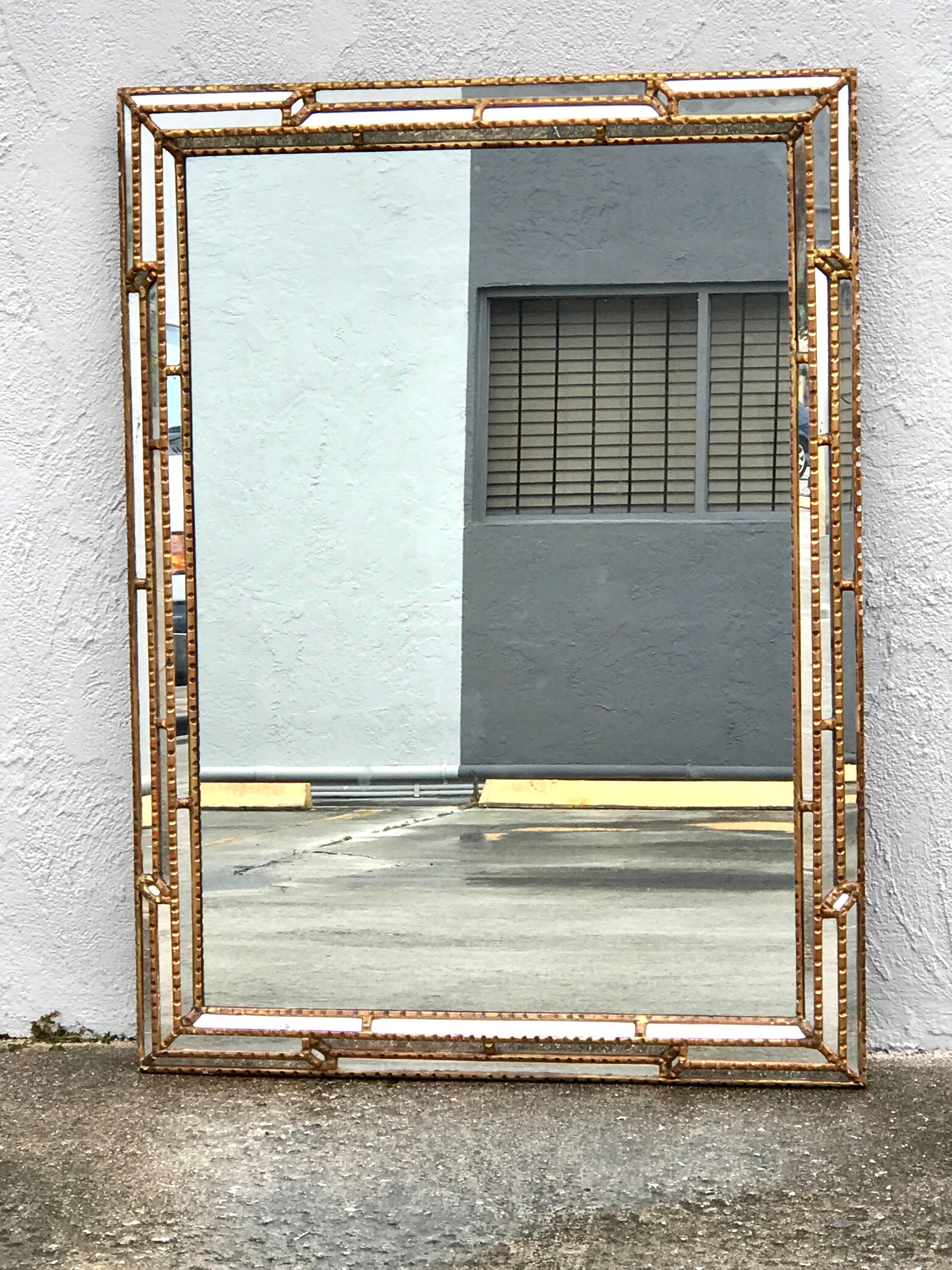 Large rectangular Italian carved giltwood mirror with continuous mirrored and carved layered giltwood frame surround, with a large clear centre 42.5