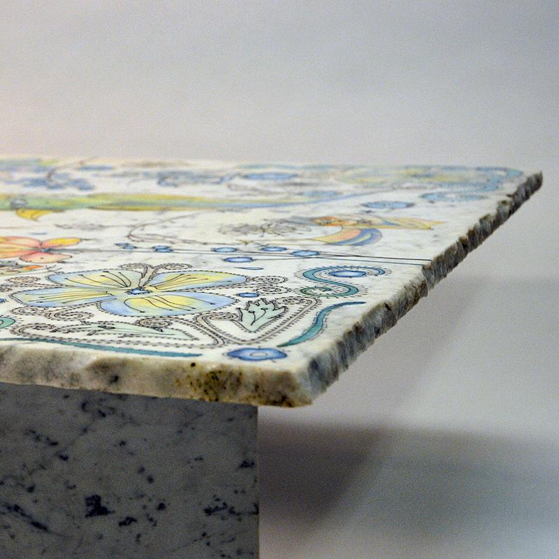 Marvellous marble table with beautiful painted decorations of people, flowers and animals on the table top, designed by Jan Tom Van der Bergen in 1984, Holland. Massive quality and beautiful design. The table top is resting on two solid marble bases