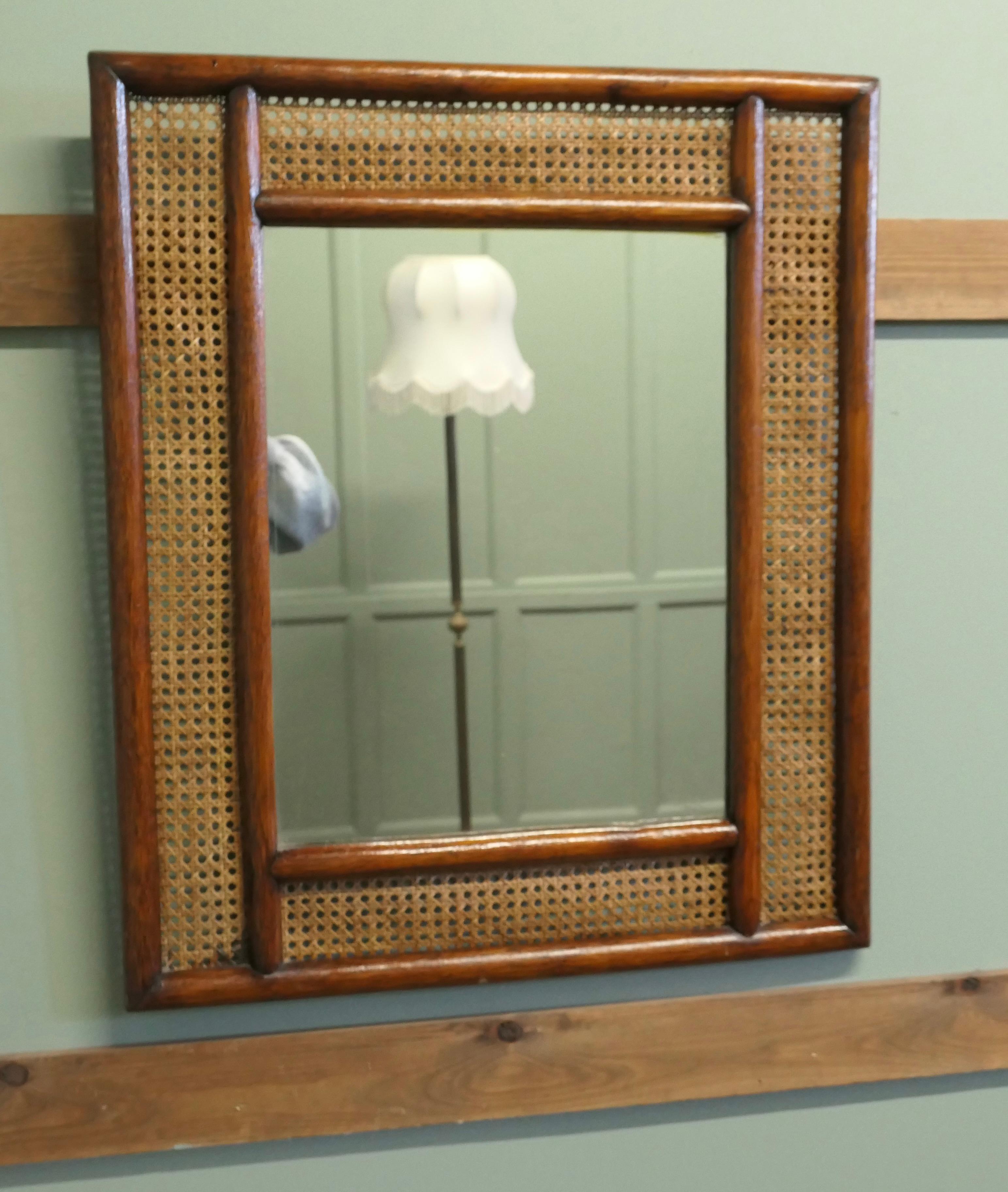 Large Rectangular Mirror with Bergère, Ratan Frame

The Mirror has a geometric moulded 6” wide frame, the infill of the frame is done in flat cane. The Mirror Frame and Glass are in good condition, a good looking glass will always add light and