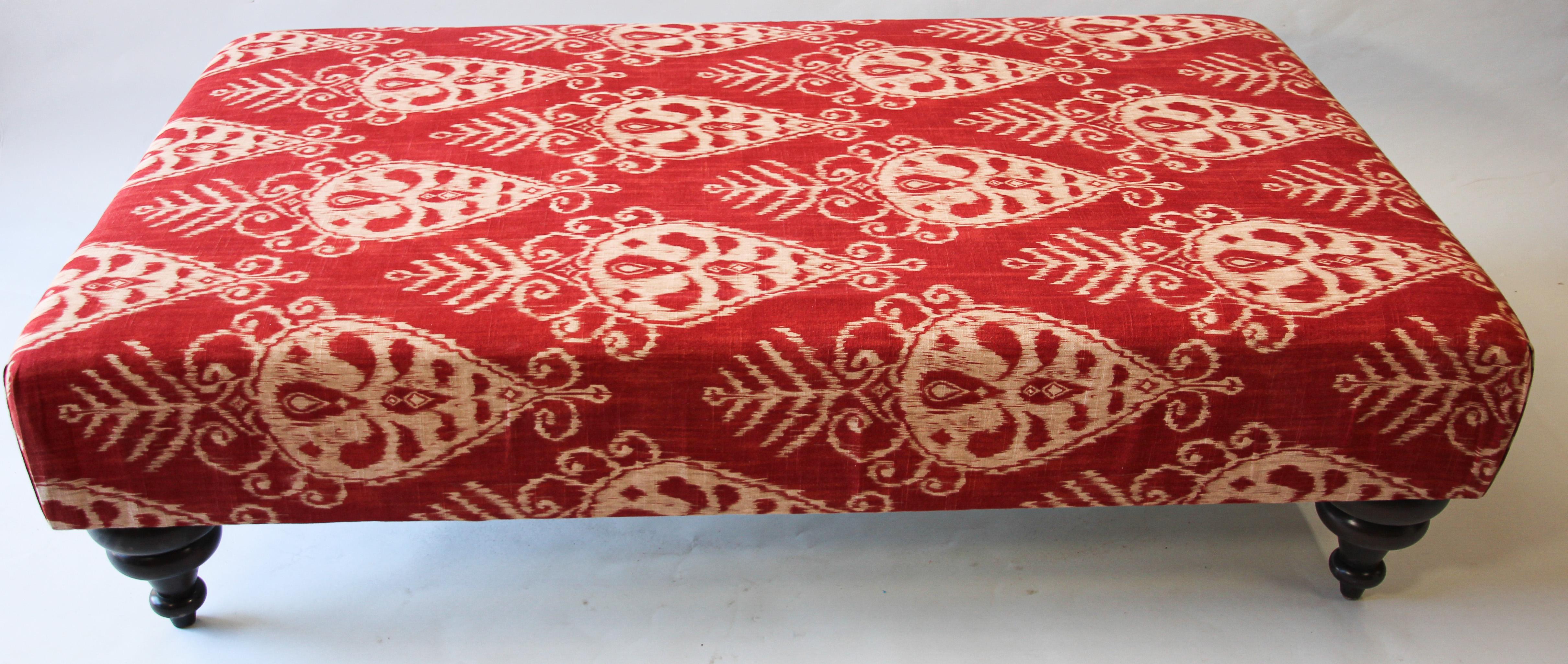 Oversized Moorish style table or ottoman.
Timelessly elegant, large upholstered ottoman, with classic turned wooden legs.
Could be used as a large rectangular bench covered with a Ikat red tribal style fabric.
Add a large Moroccan tray on it and use