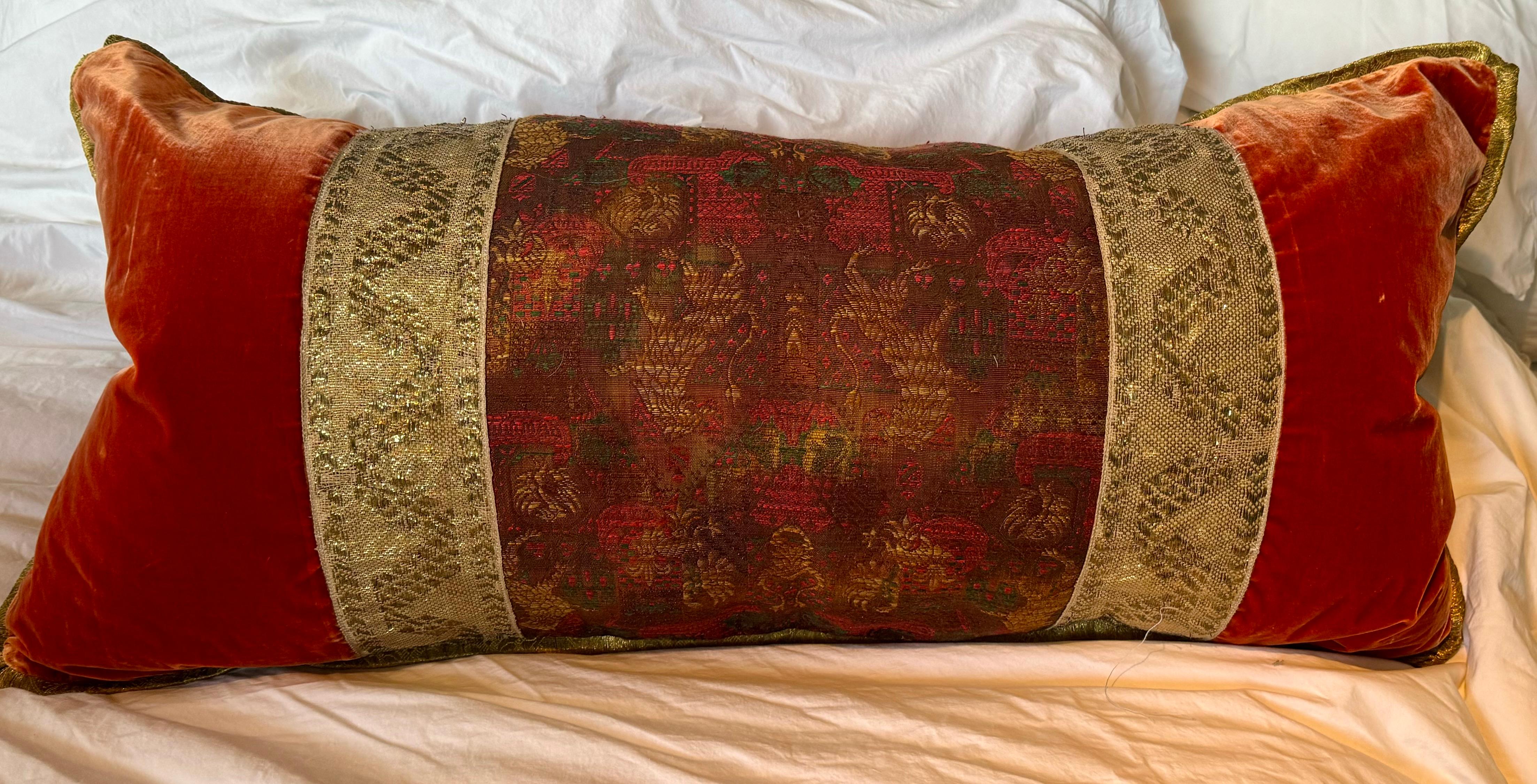 Made from an antique Chinese silk textile, this large rectangular lumbar pillow is refined yet opulent. It is fabricated from an Asian brocade antique textile and luxurious 19th century silk velvets. The Chinese textile inspired the combination of