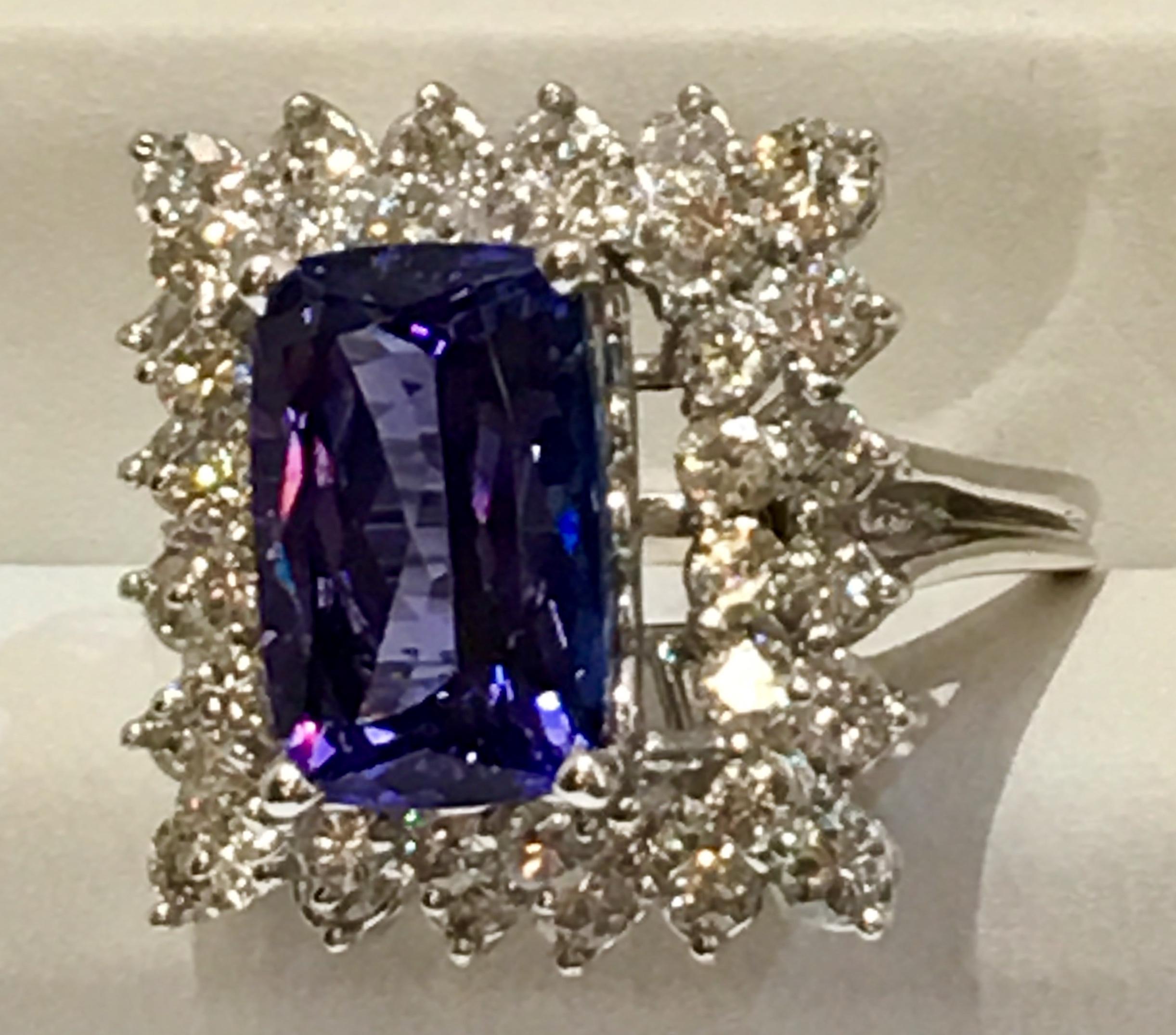 Contemporary Showy 10.5 Carat Vivid Tanzanite Double Diamond Halo White Gold Cocktail Ring For Sale
