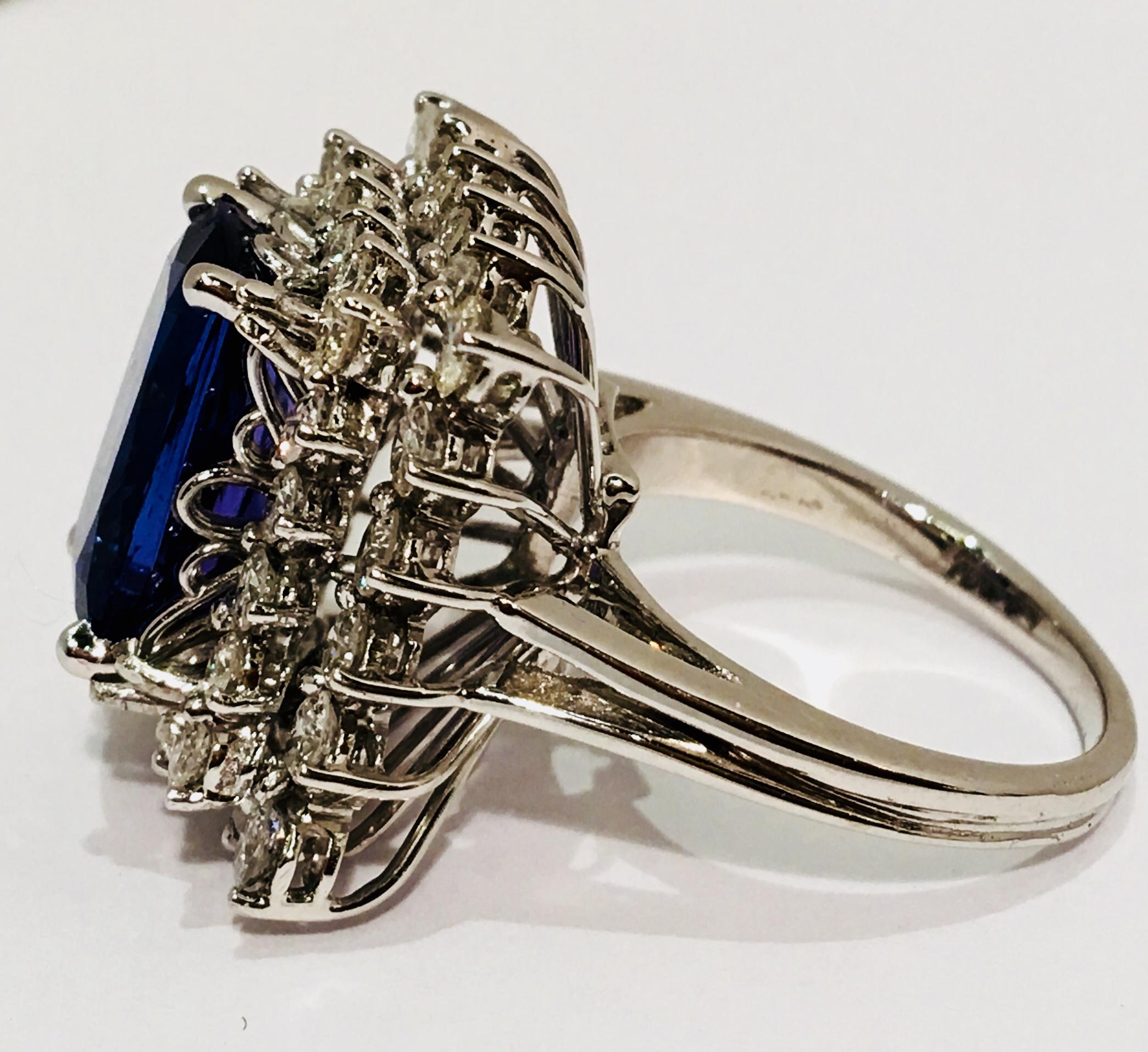 Radiant Cut Showy 10.5 Carat Vivid Tanzanite Double Diamond Halo White Gold Cocktail Ring For Sale