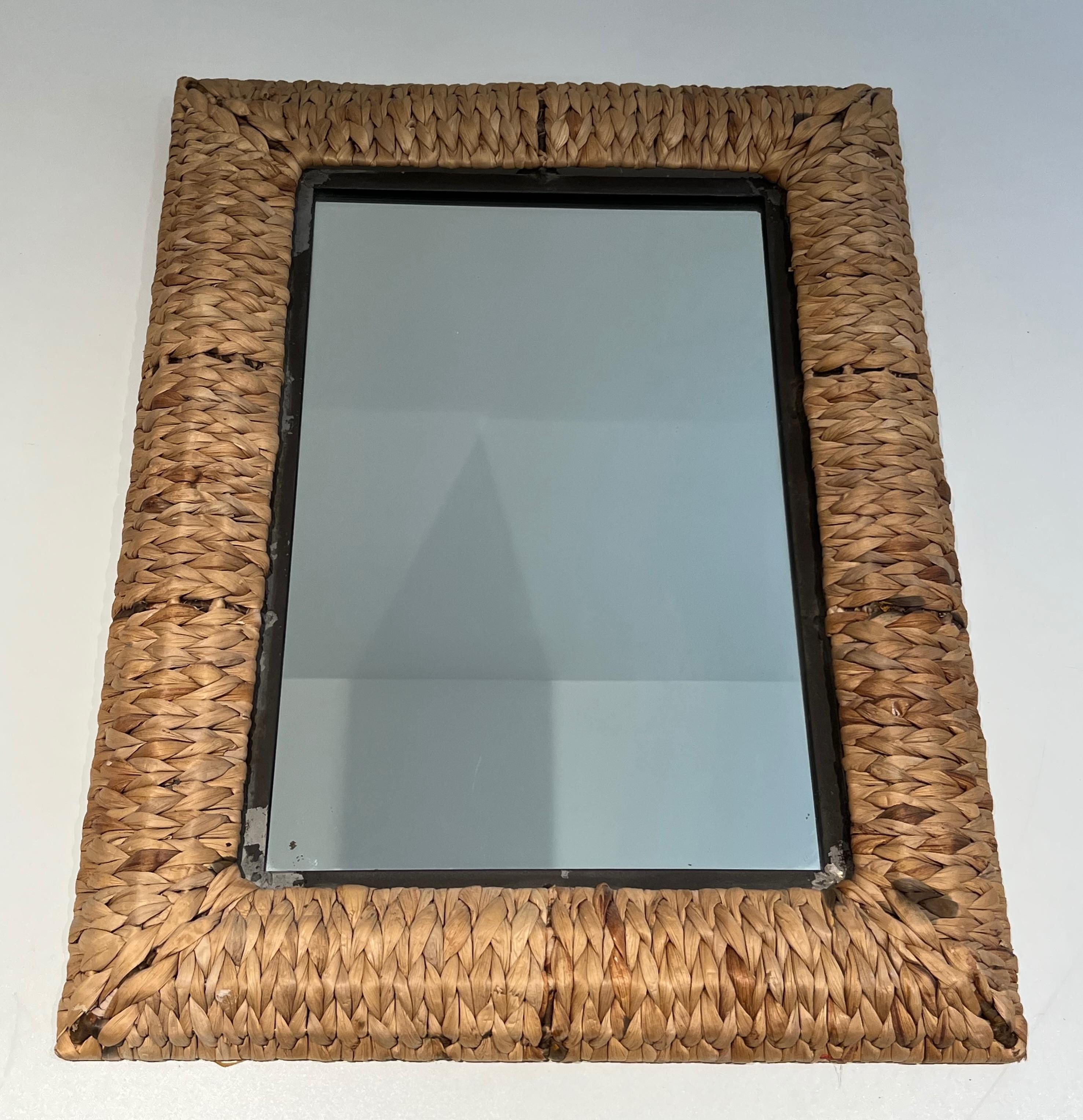 This large rectangular mirror is made of iron and rope mirror. This is a French work. Circa 1970