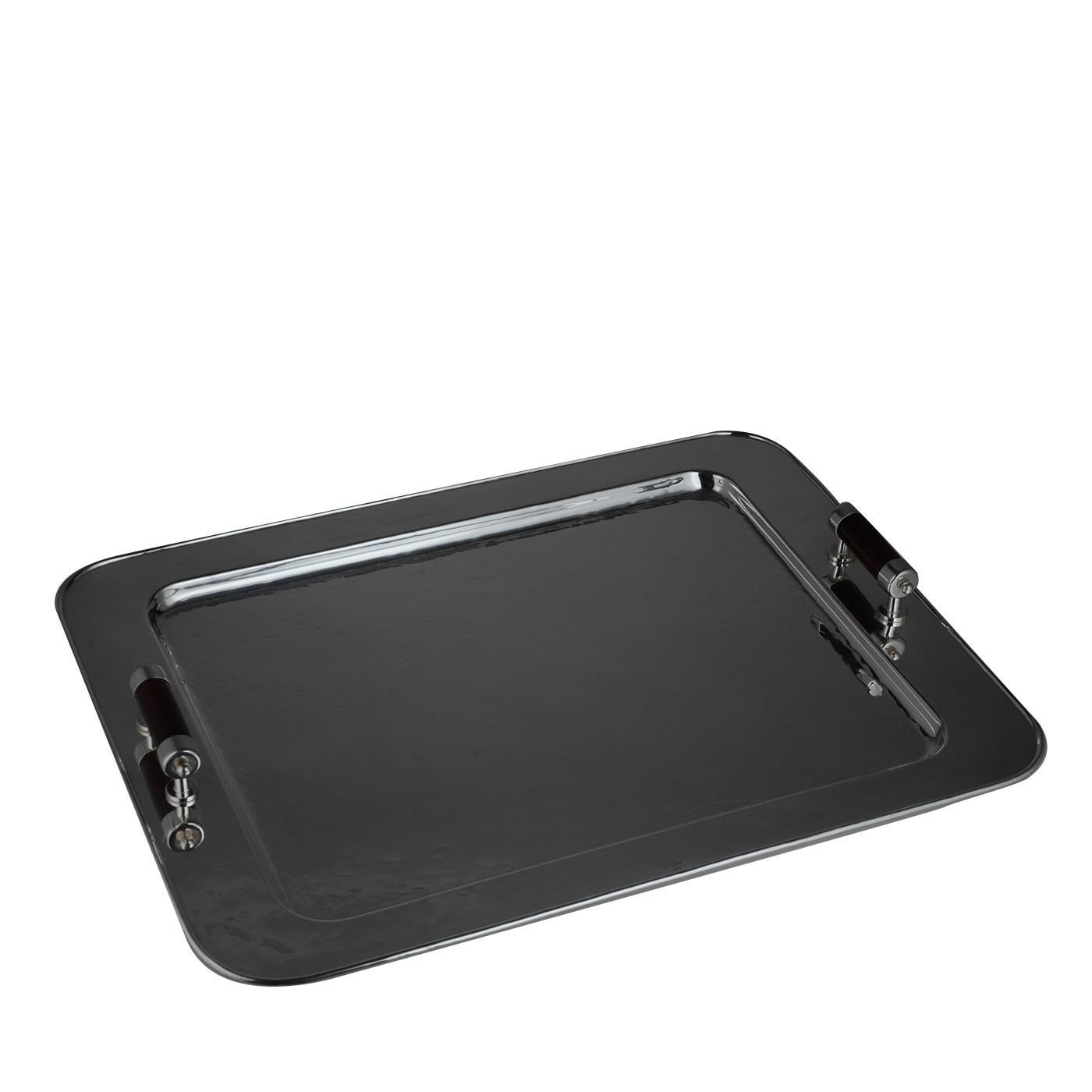 This elegant rectangular tray will be a sophisticated addition to a classically decorated home. Its generous size makes it a versatile object that can also be used as centerpiece. The rectangular Silhouette features round corners that add a gentle