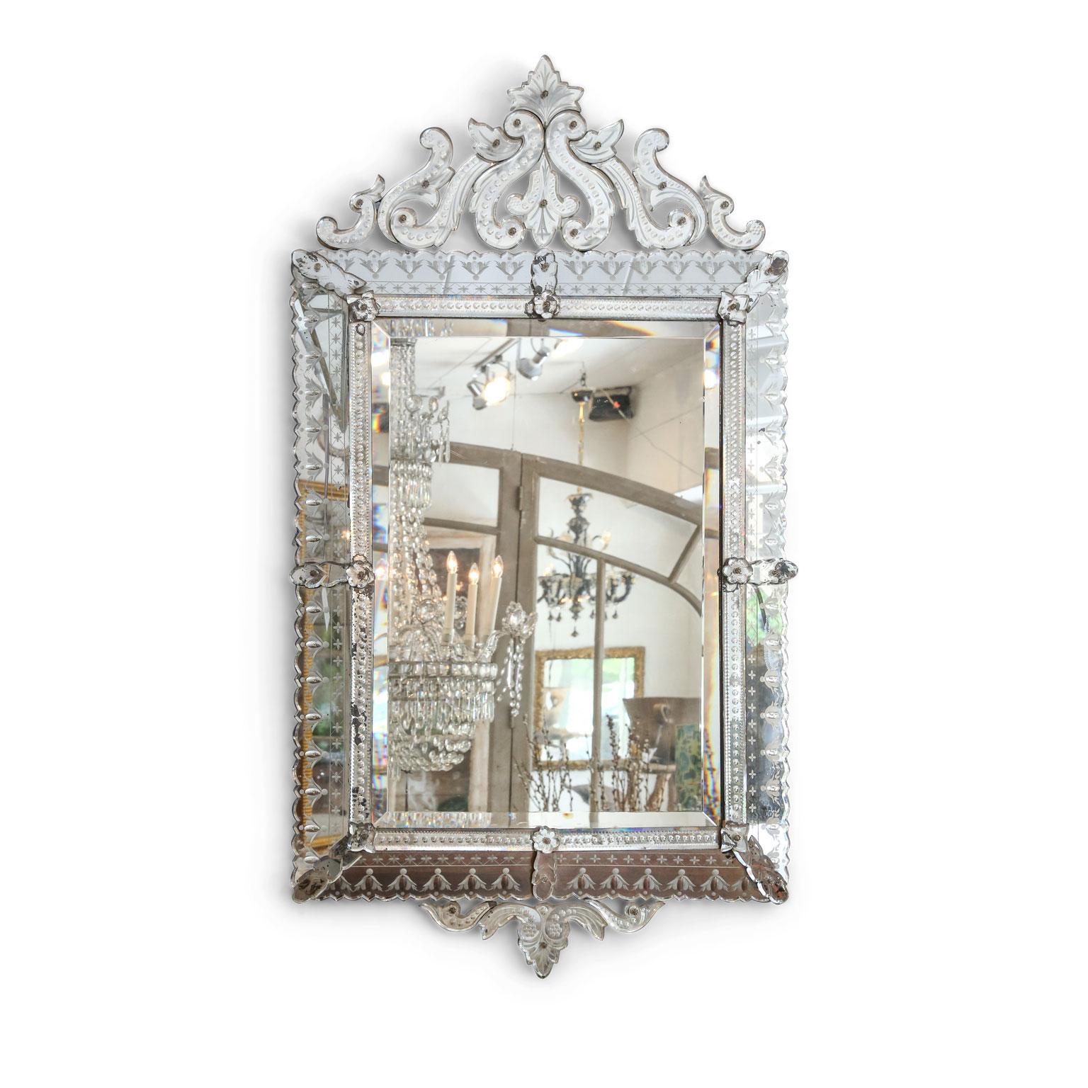 Large rectangular Venetian mirror, (circa 1870-1880). Topped by elaborate openwork pediment. Exceptional condition with only minor losses to its silvered mirror backing.