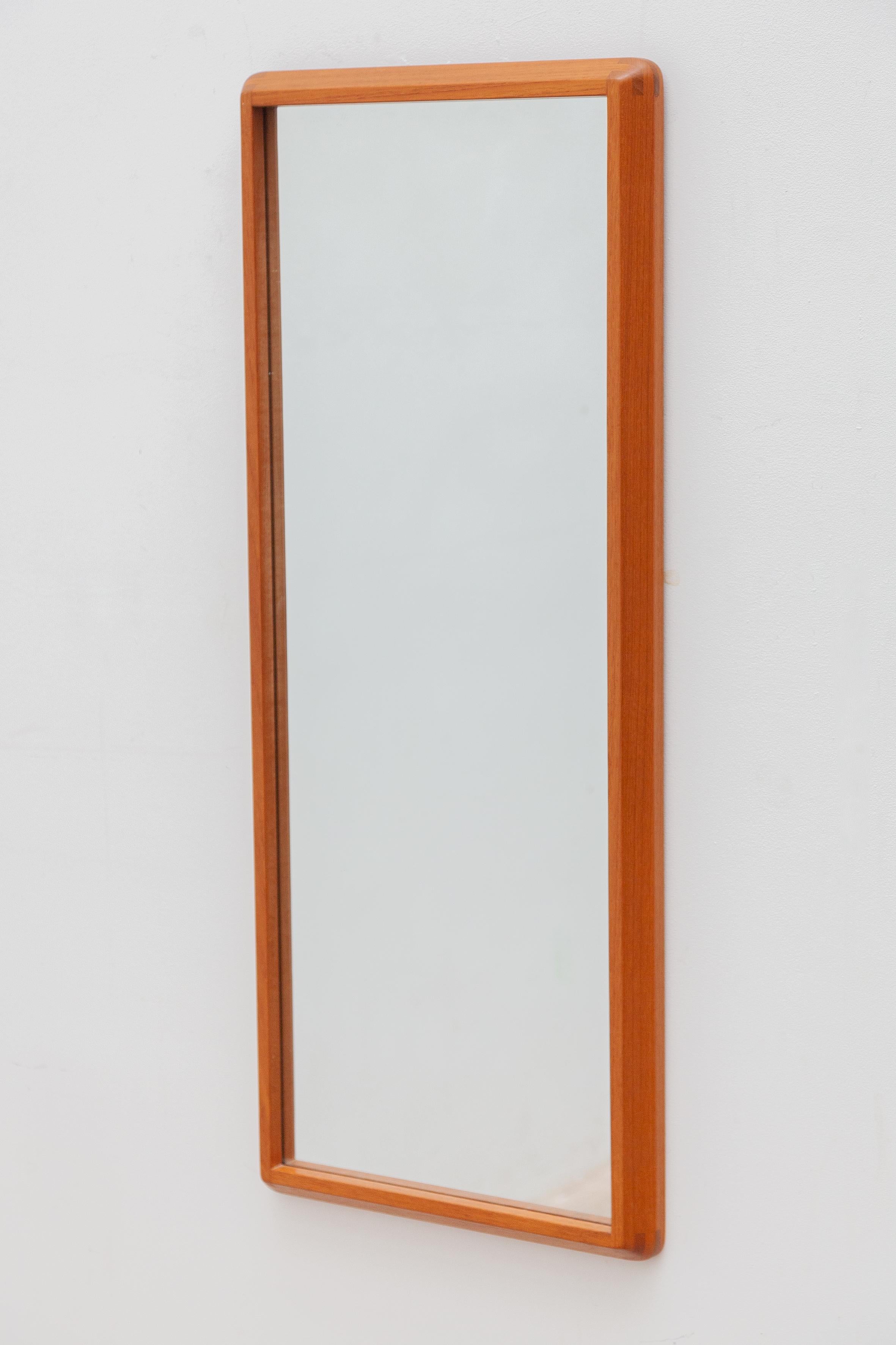 Wall mirror designed by Kai Kristiansen and manufactured by Aksel Kjersgaard. Very well crafted design, circular inset that serve both the construction and design of the piece. Excellent, vintage condition. Mirror glass is clean. 




Wiring