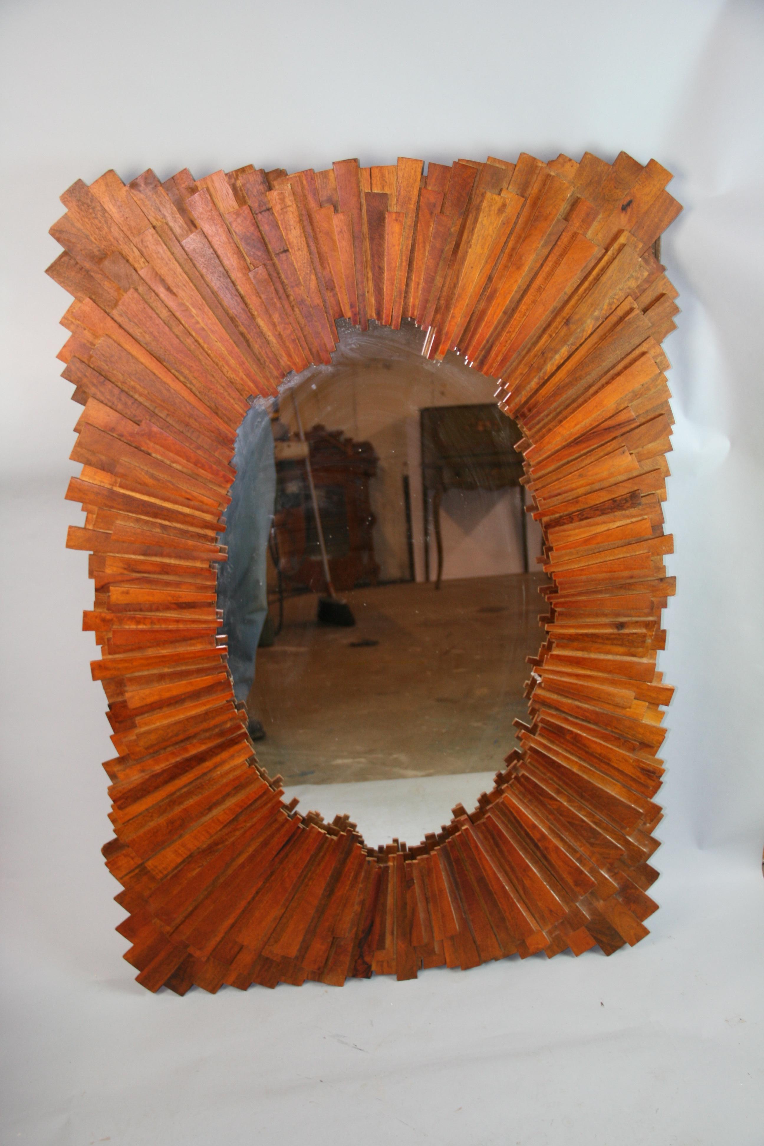 1288 Large wood starburst mirror made from individual pieces of hardwood/
Can be hung vertical or horizontal with attached hardware.