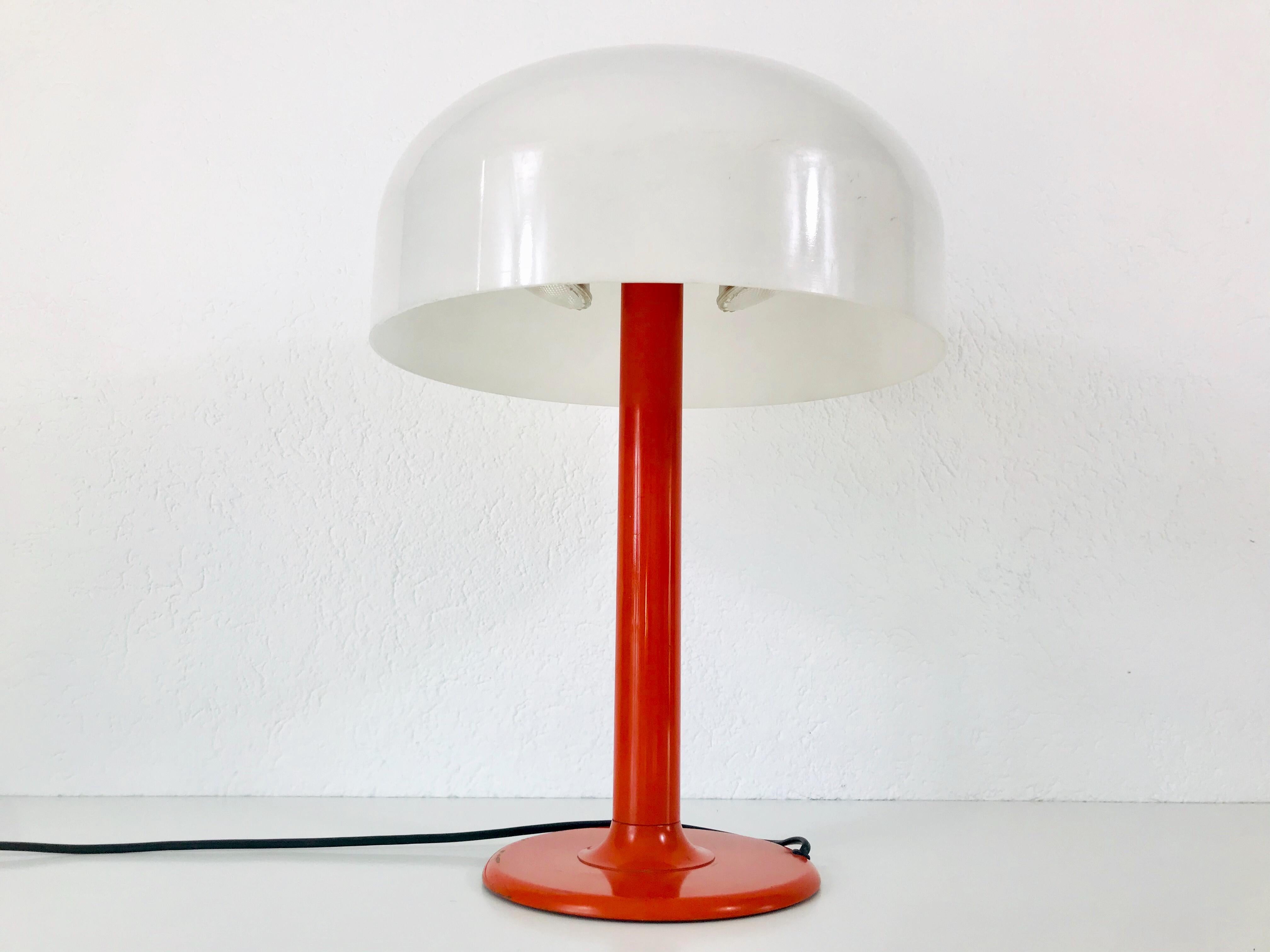 A table lamp in mushroom shape made in the 1970s. It is similar to the table lamps designed by Verner Panton.