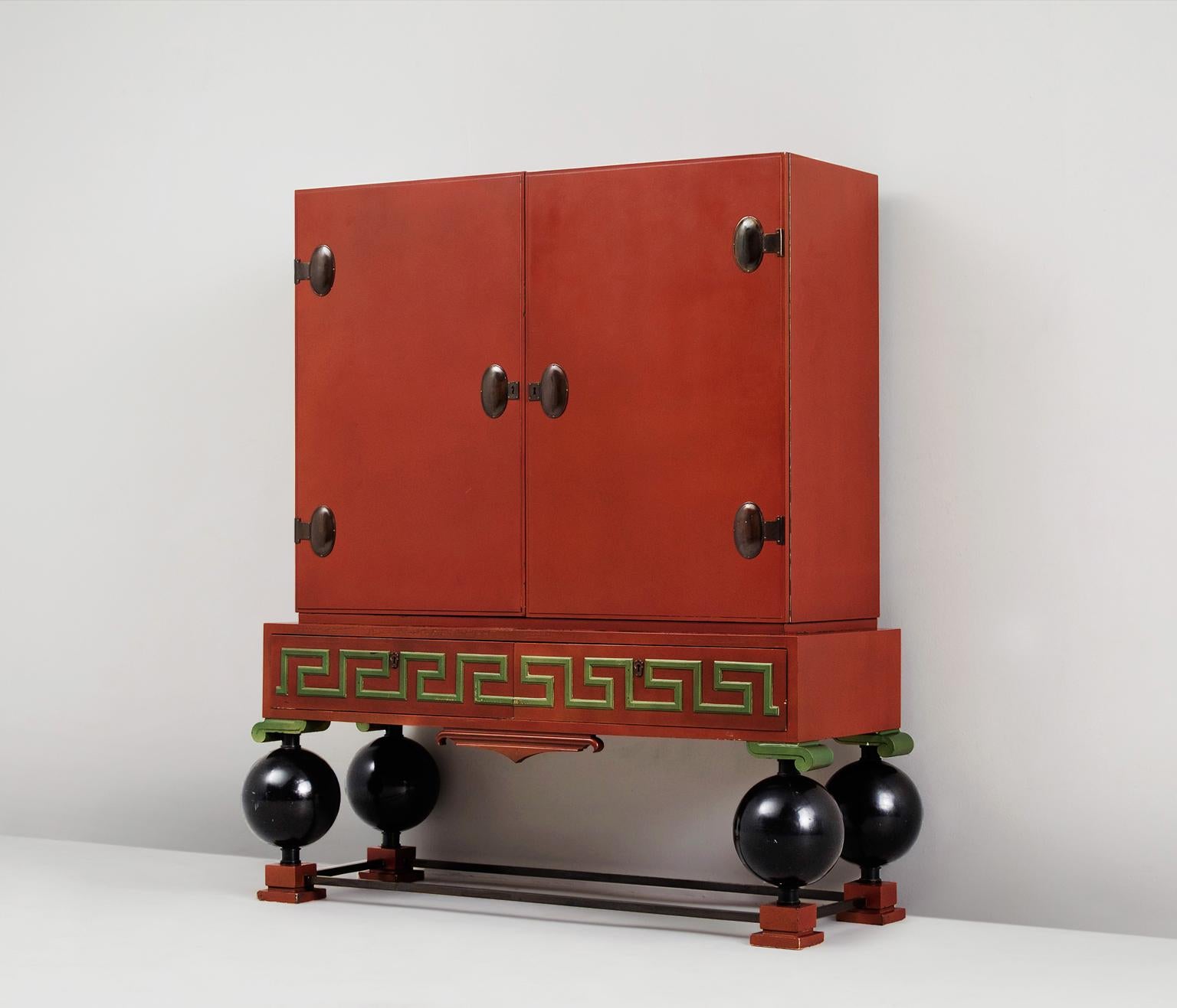 Paul Boberg, cabinet, wood and metal, by Sweden, 1930s. 

Large decorative cabinet, in red and green. At the front this highboard is divided over two large doors and two drawers. All compartments can be locked. Once opened, a 